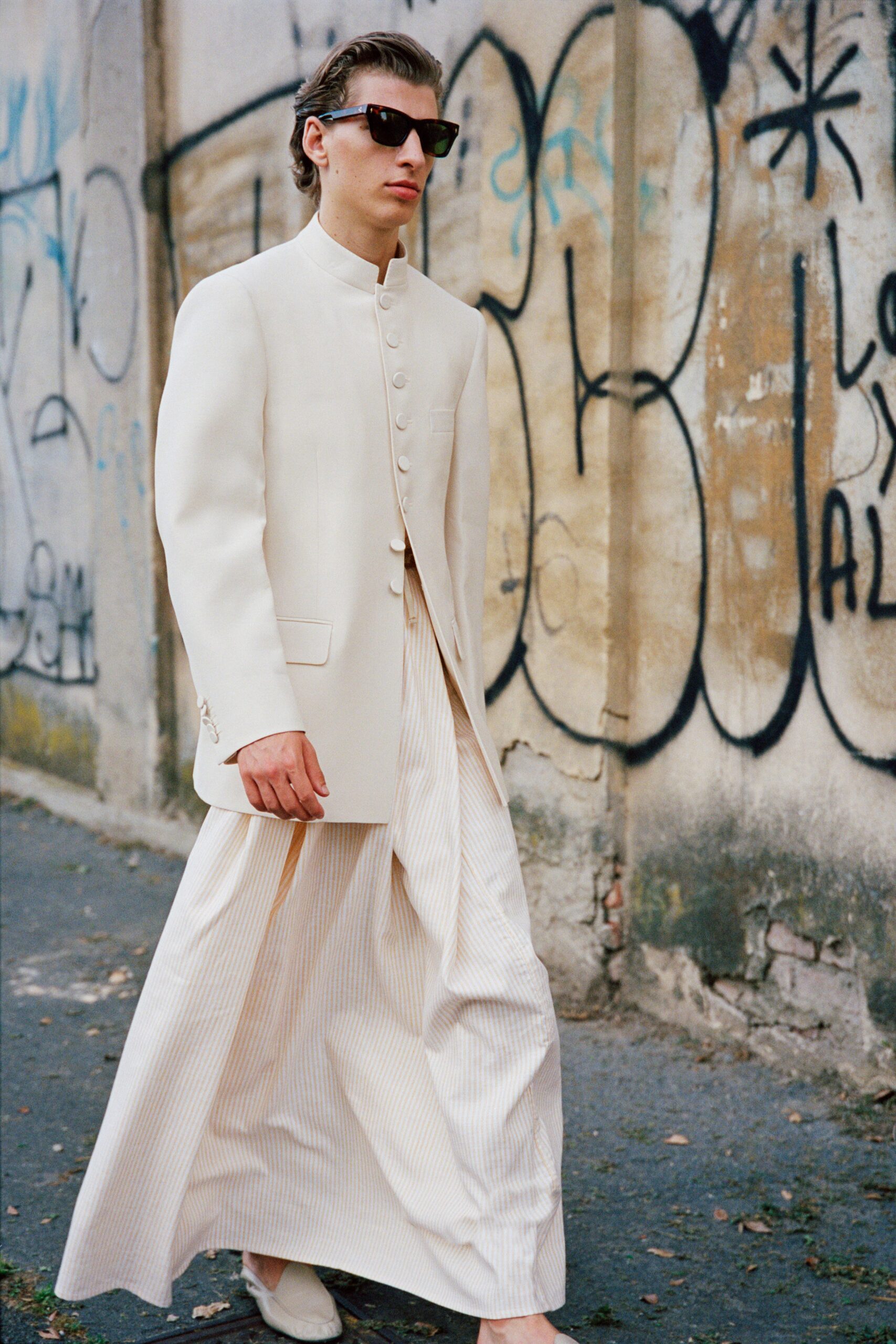 white tailored blazer with beige pants