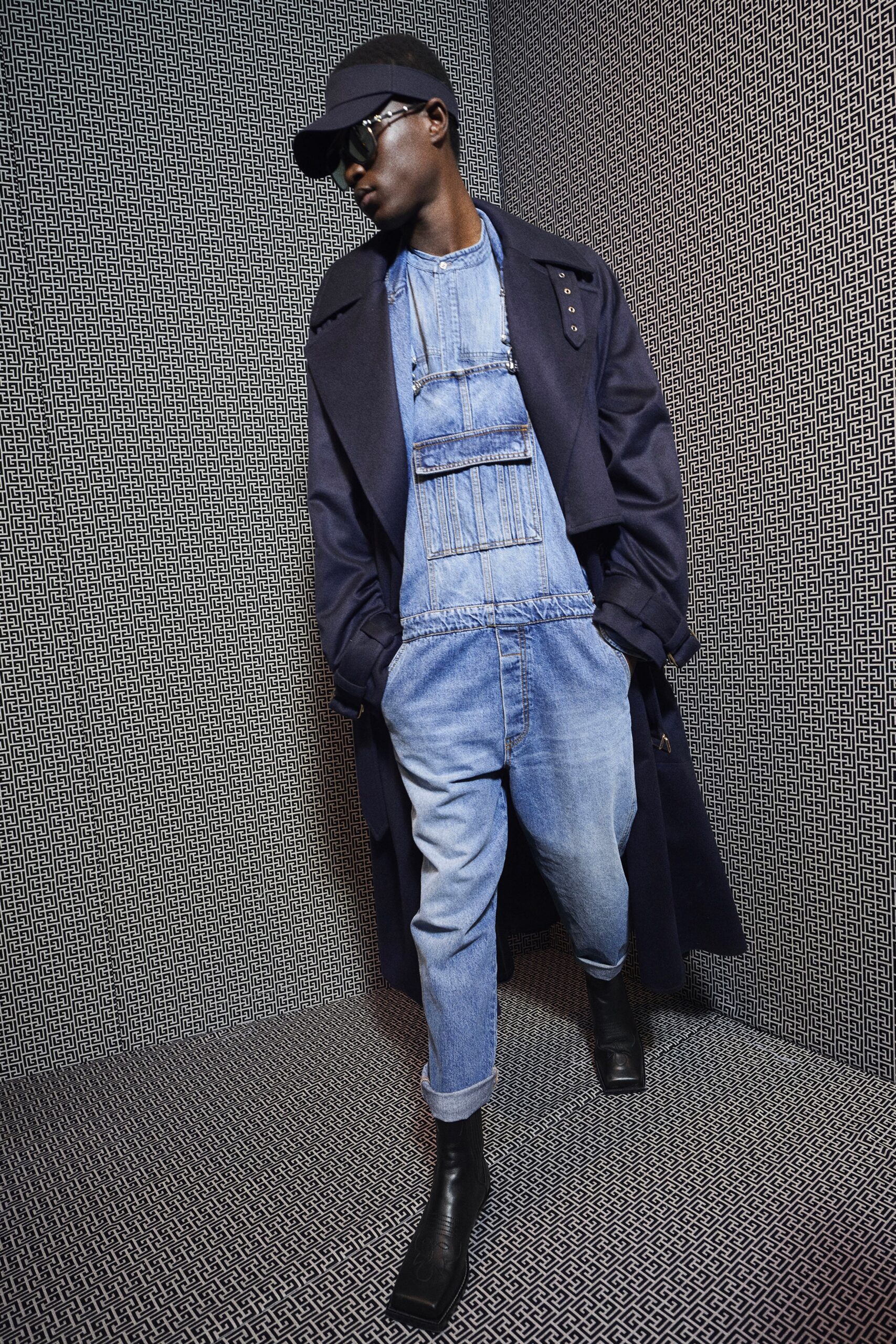 black wool coat and blue denim jumpsuit