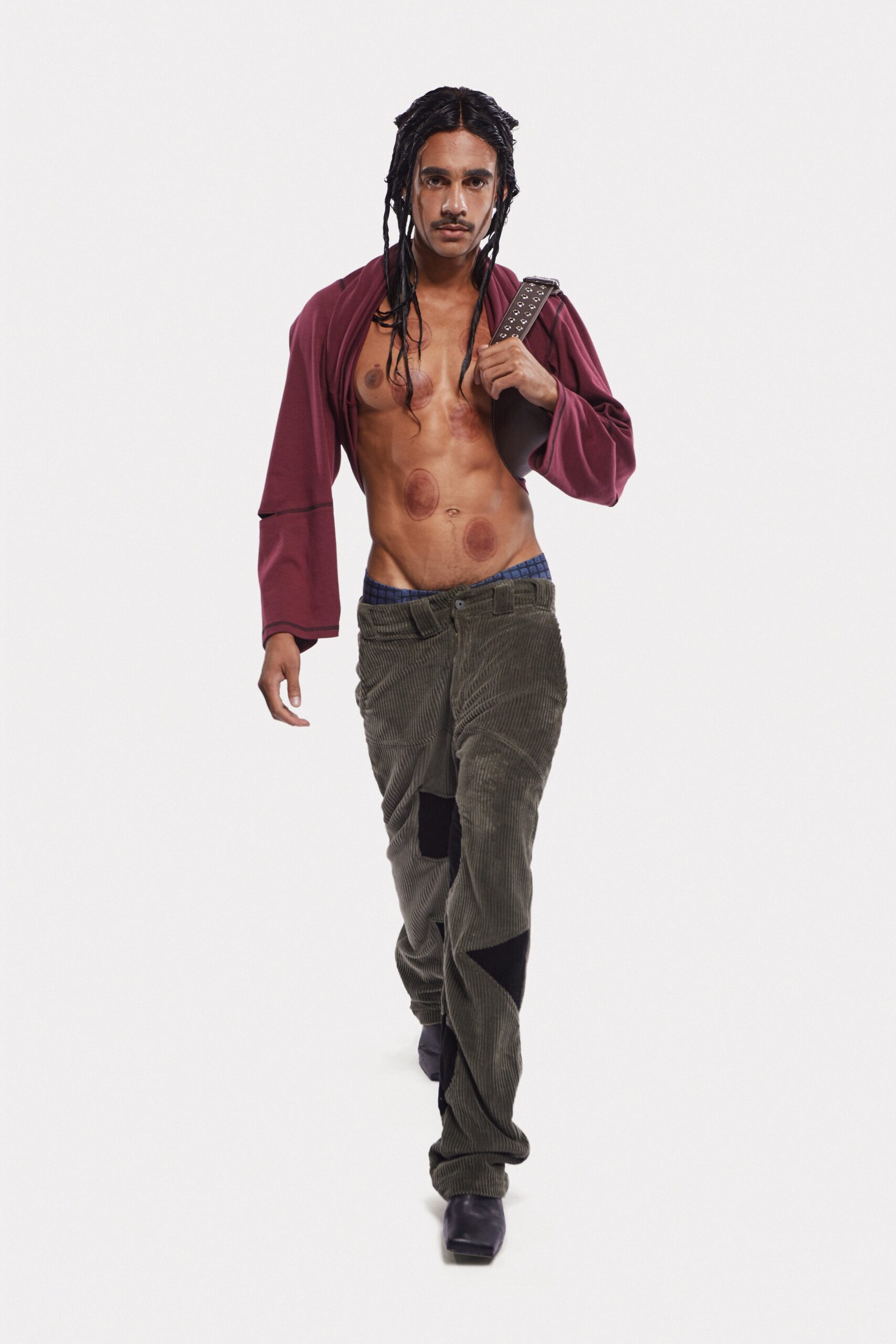 relaxed red jacket and green cargo pants