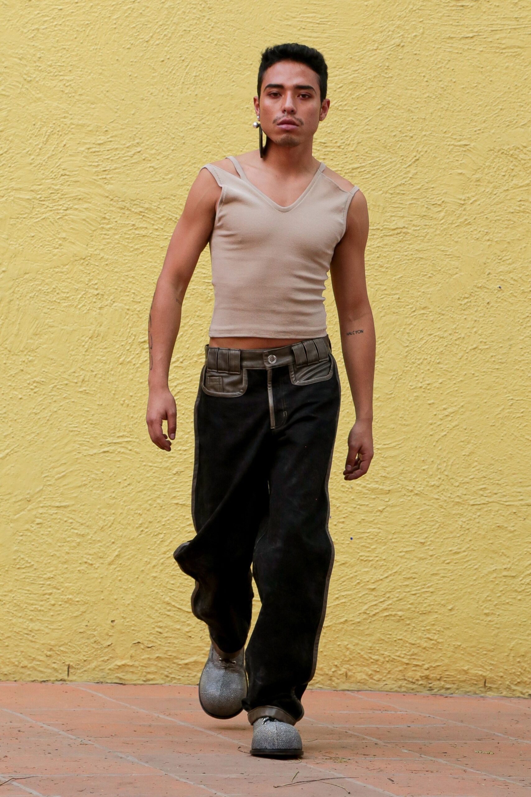 beige fitted top and black relaxed pants