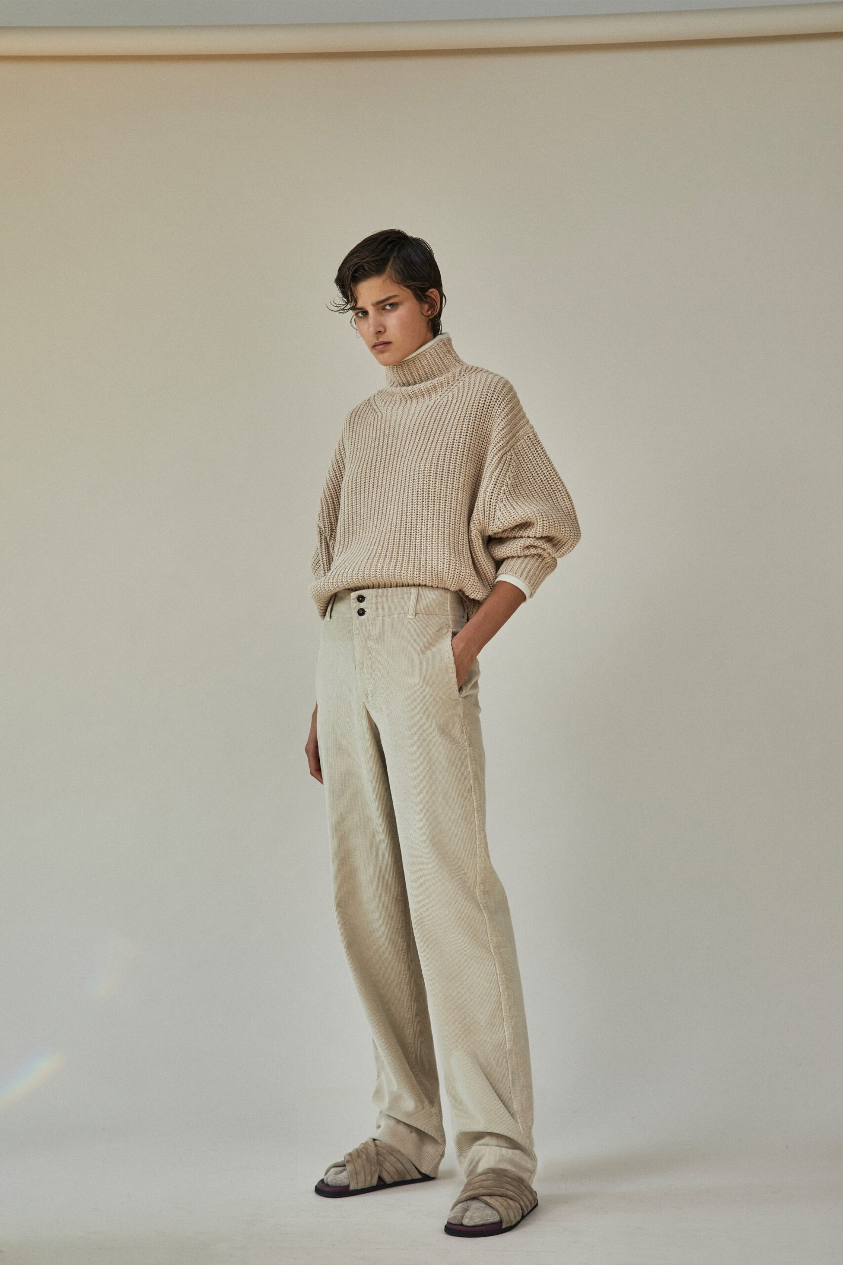 beige relaxed sweater and white pants