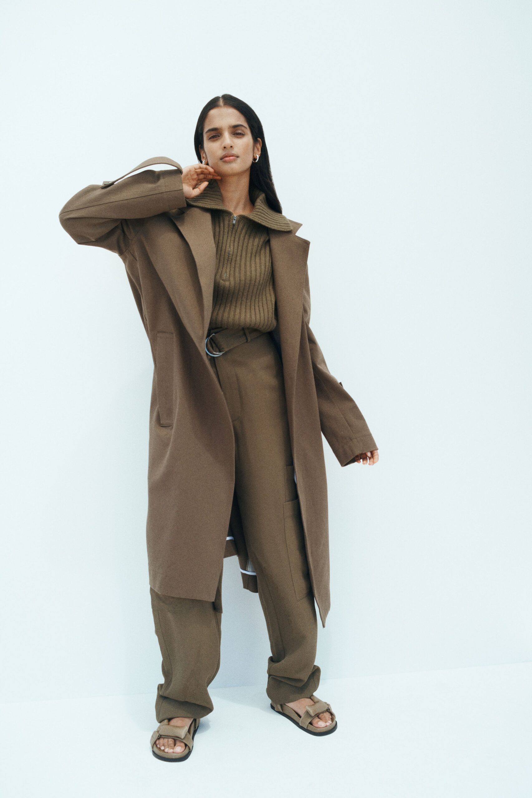 brown wool coat with green knit top
