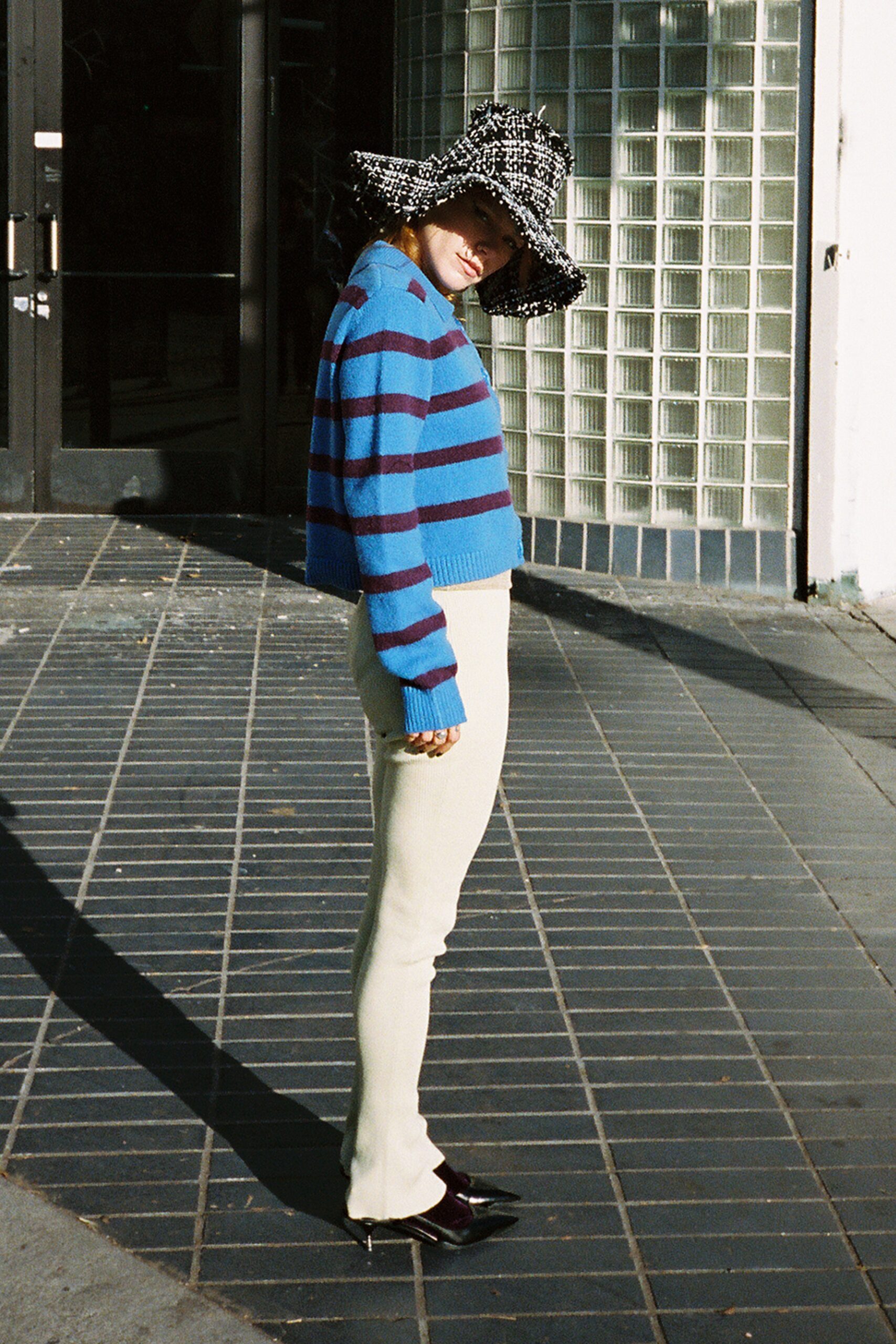 blue striped cropped sweater with white pants