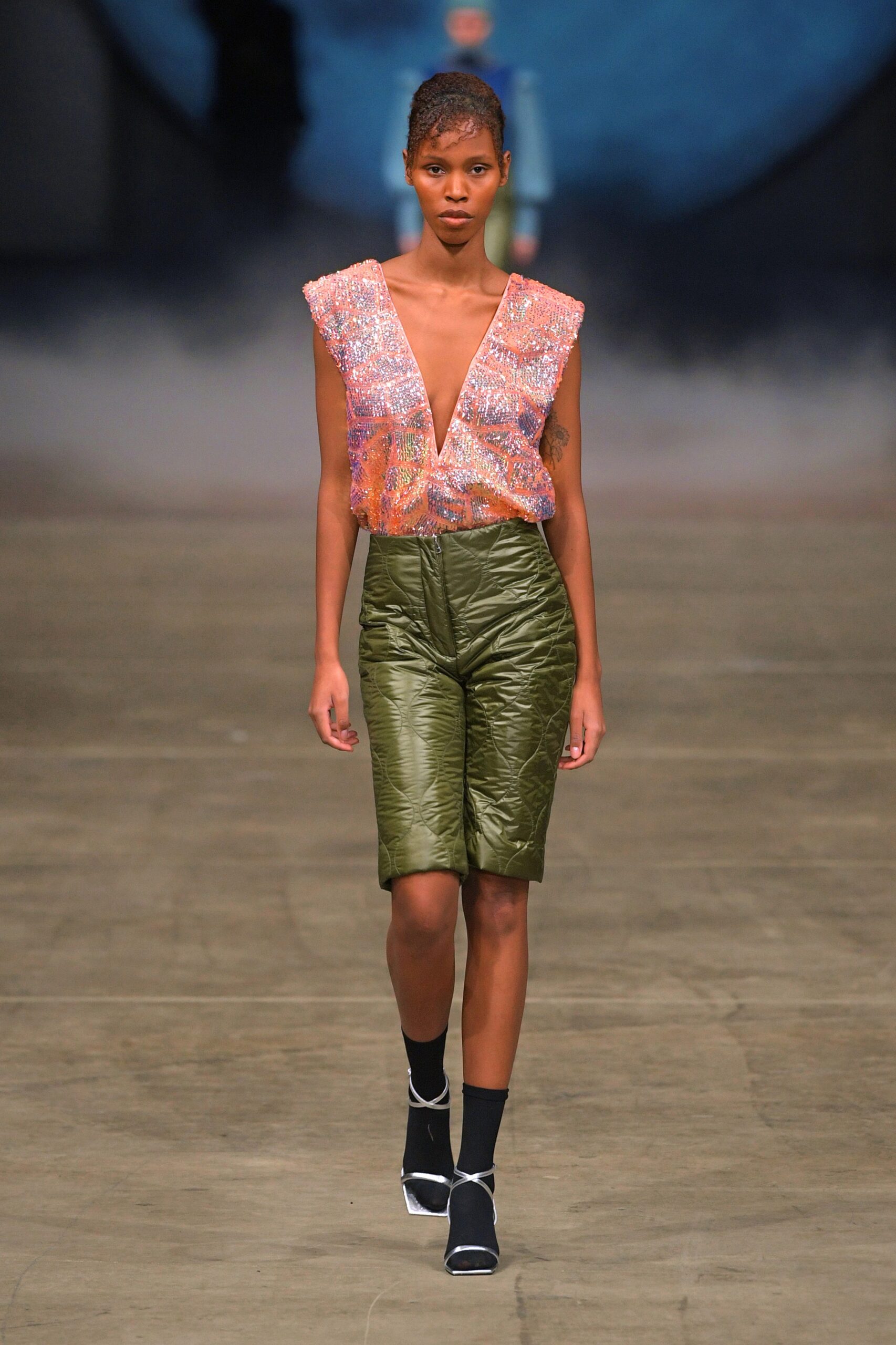 sequined pink top with green shorts