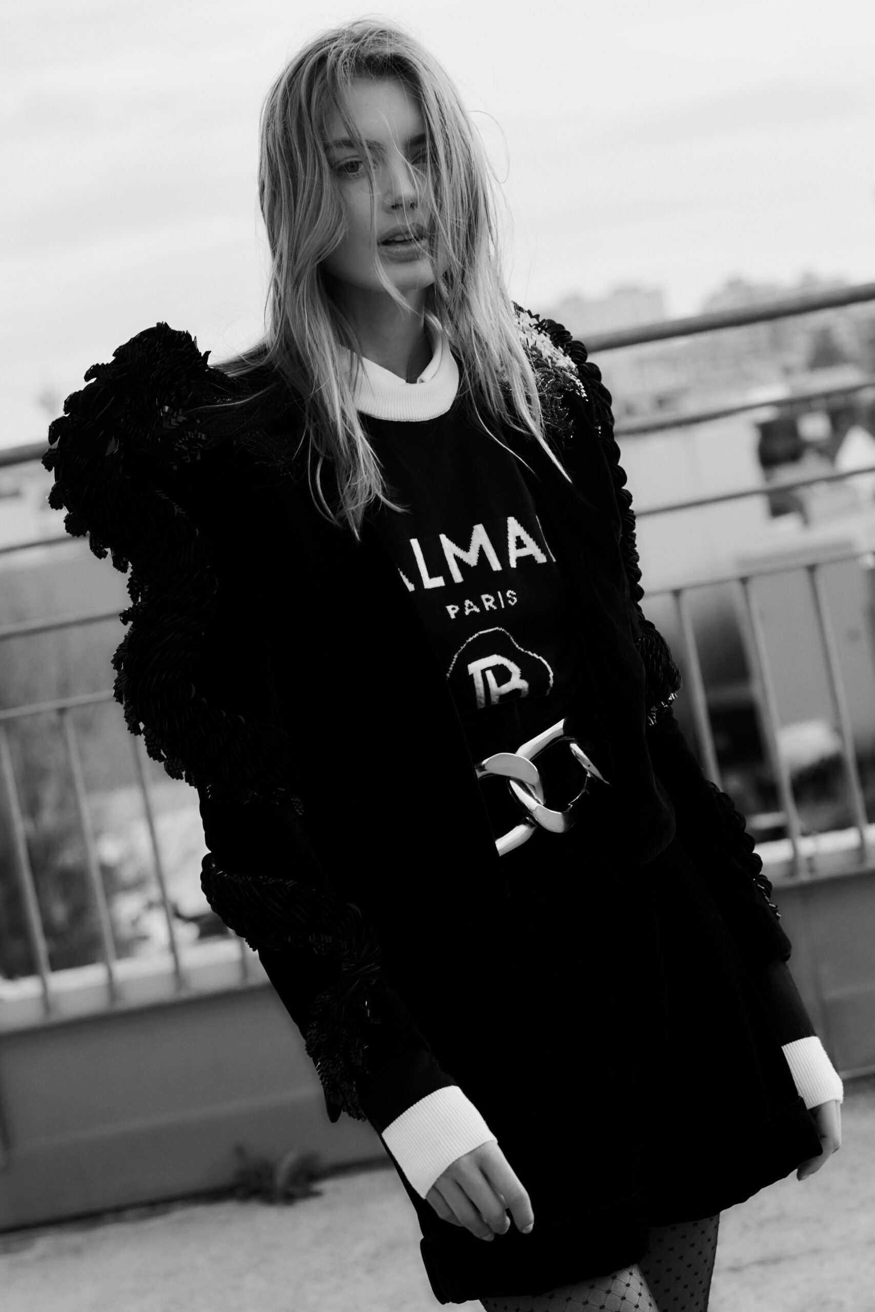 black fitted dress with structured jacket