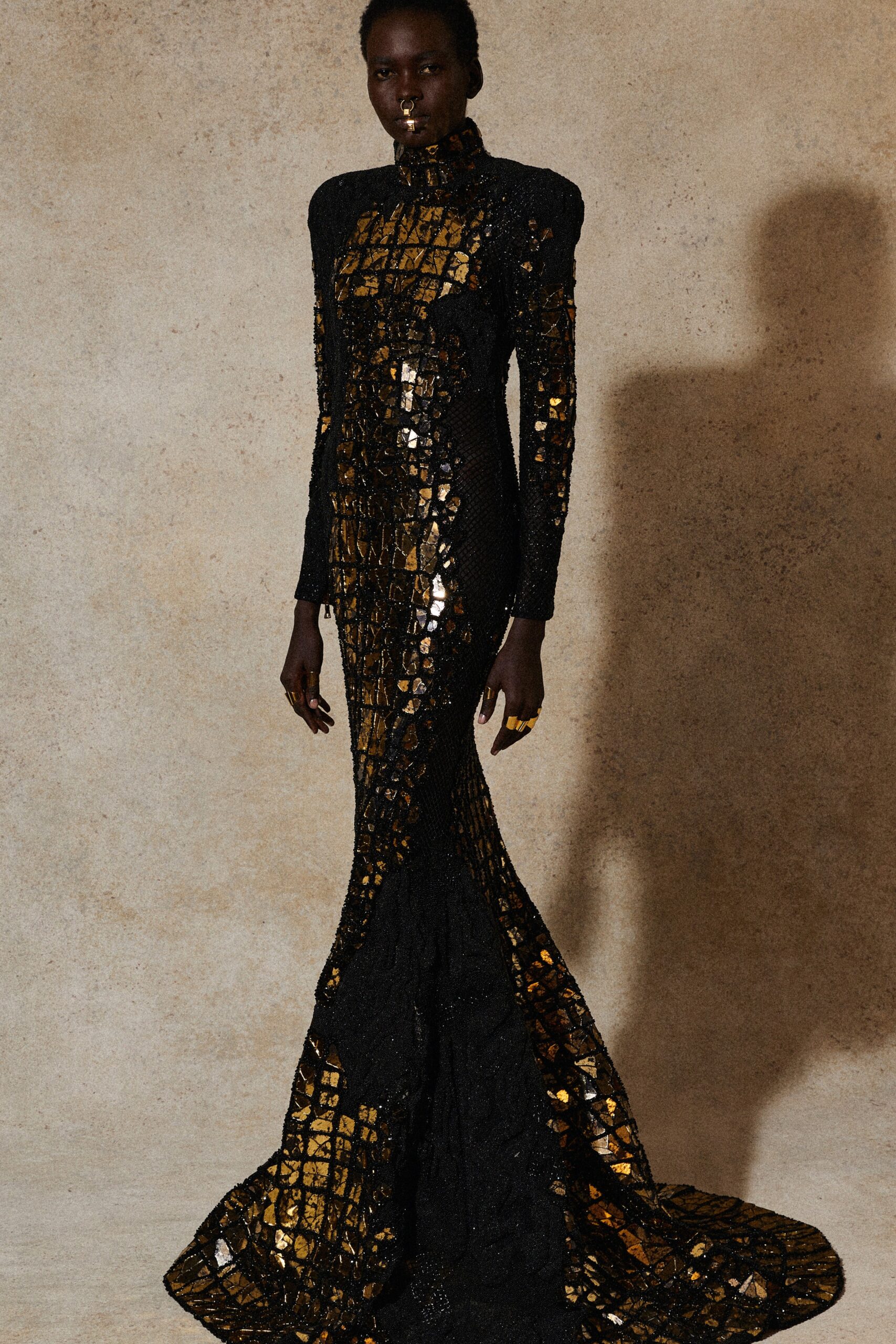 fitted black and gold sequin gown