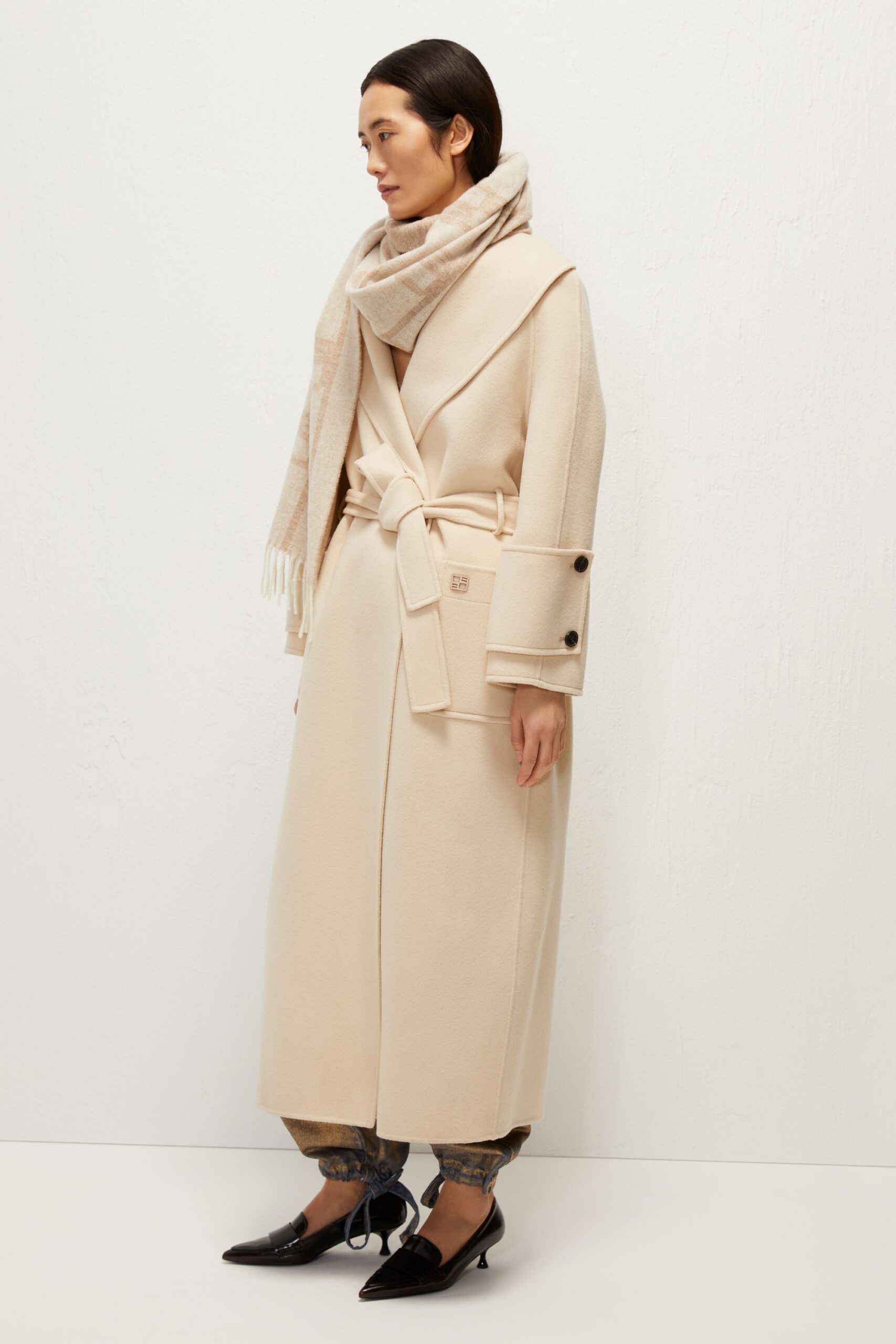 beige wool coat with denim pants