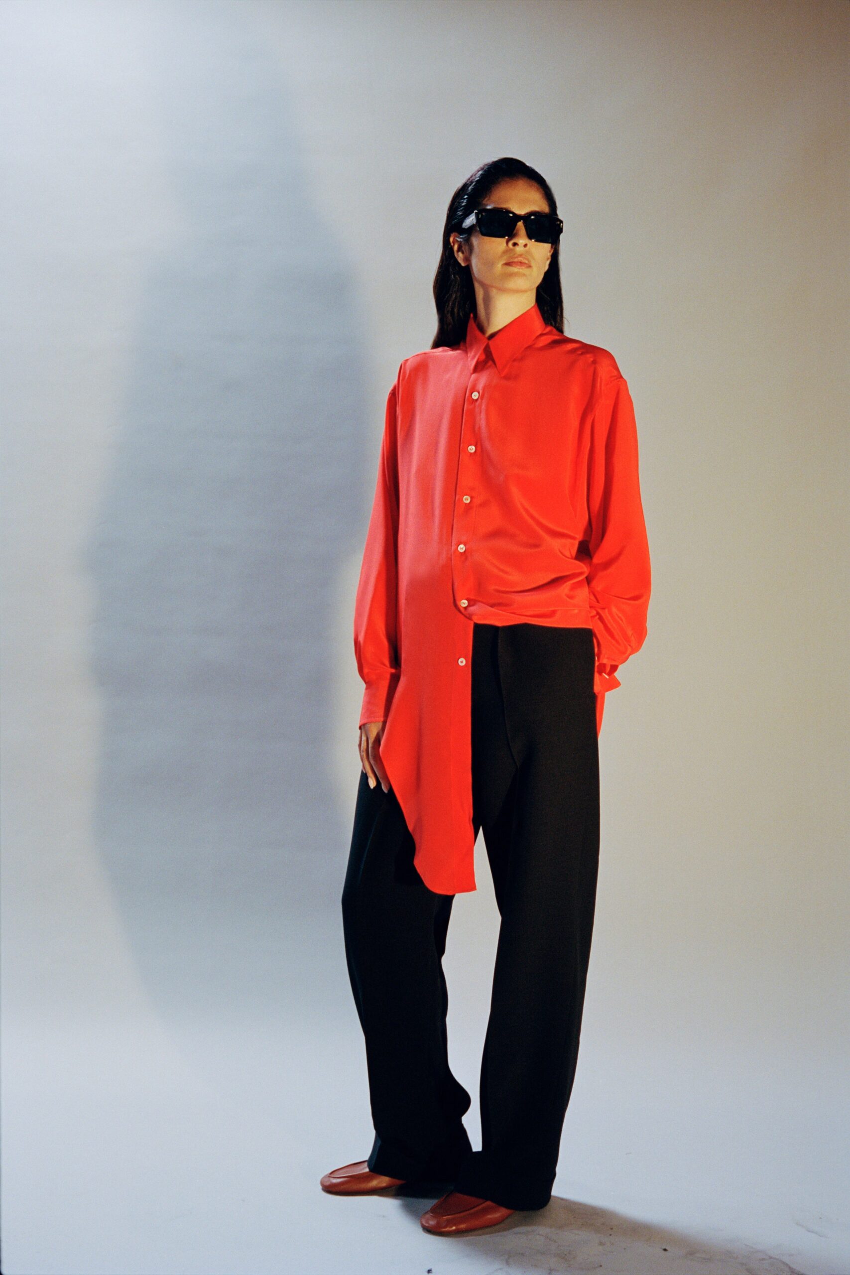 red silk shirt with relaxed pants