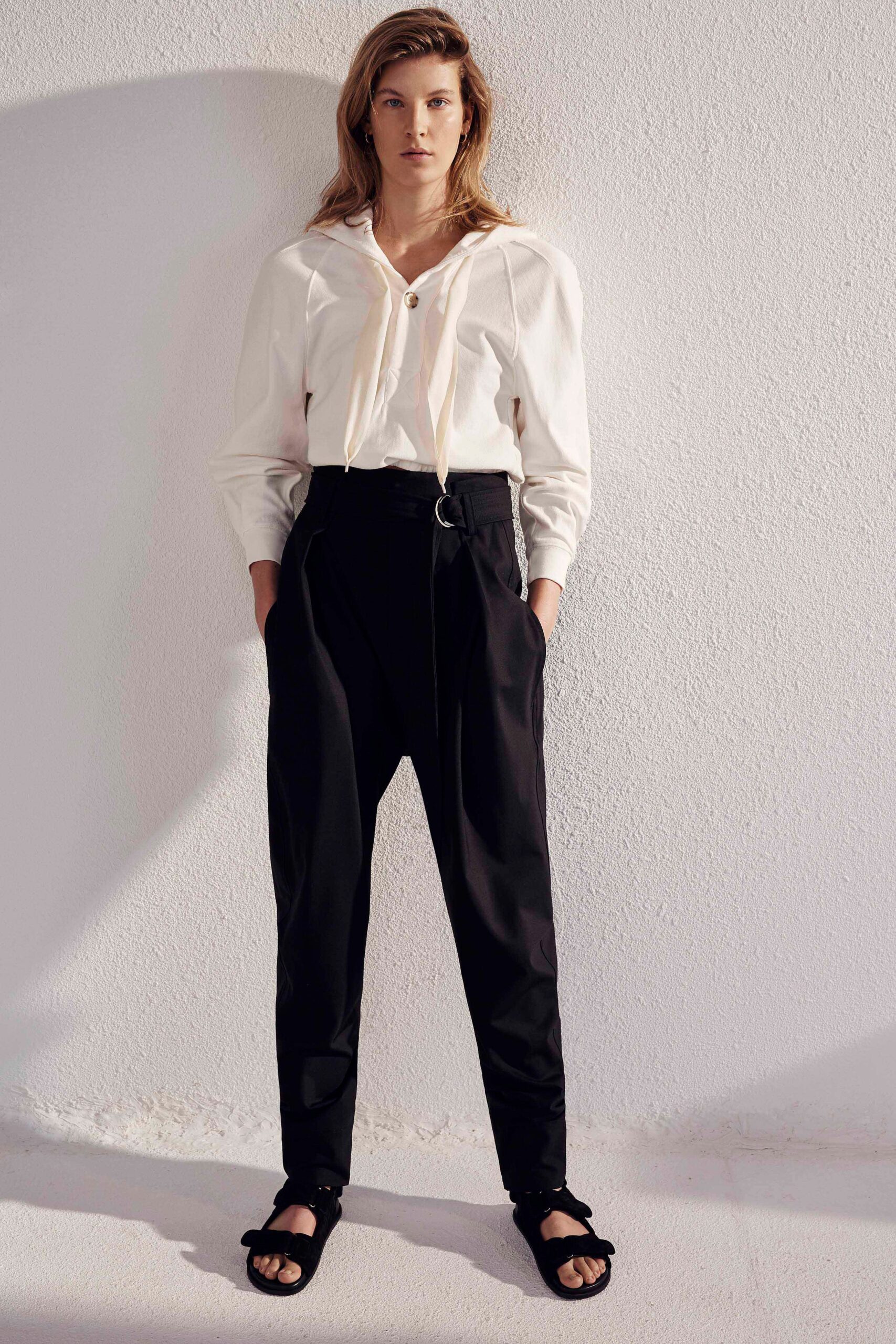 white relaxed shirt with black tailored pants