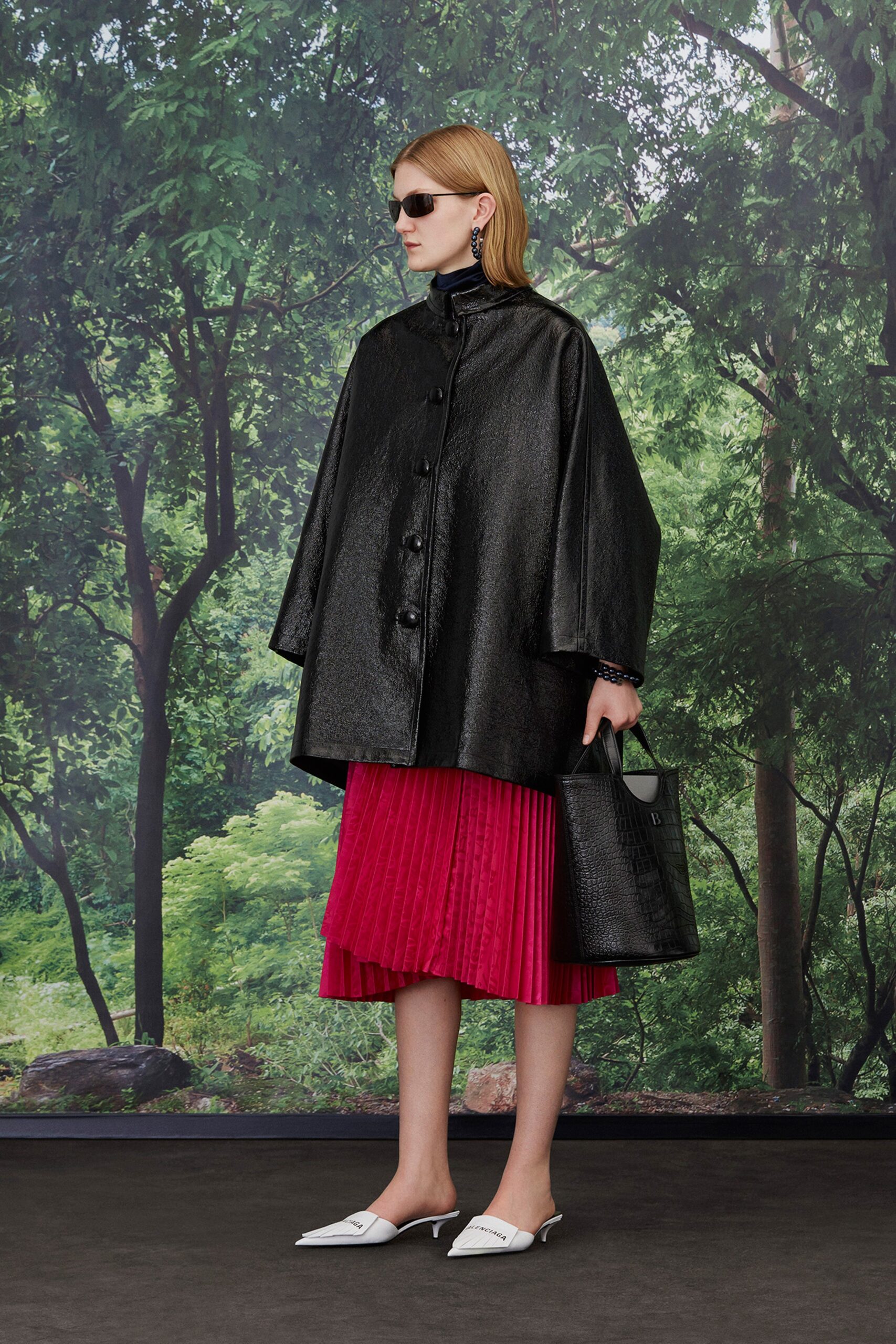 black vinyl oversized coat with pink pleated skirt