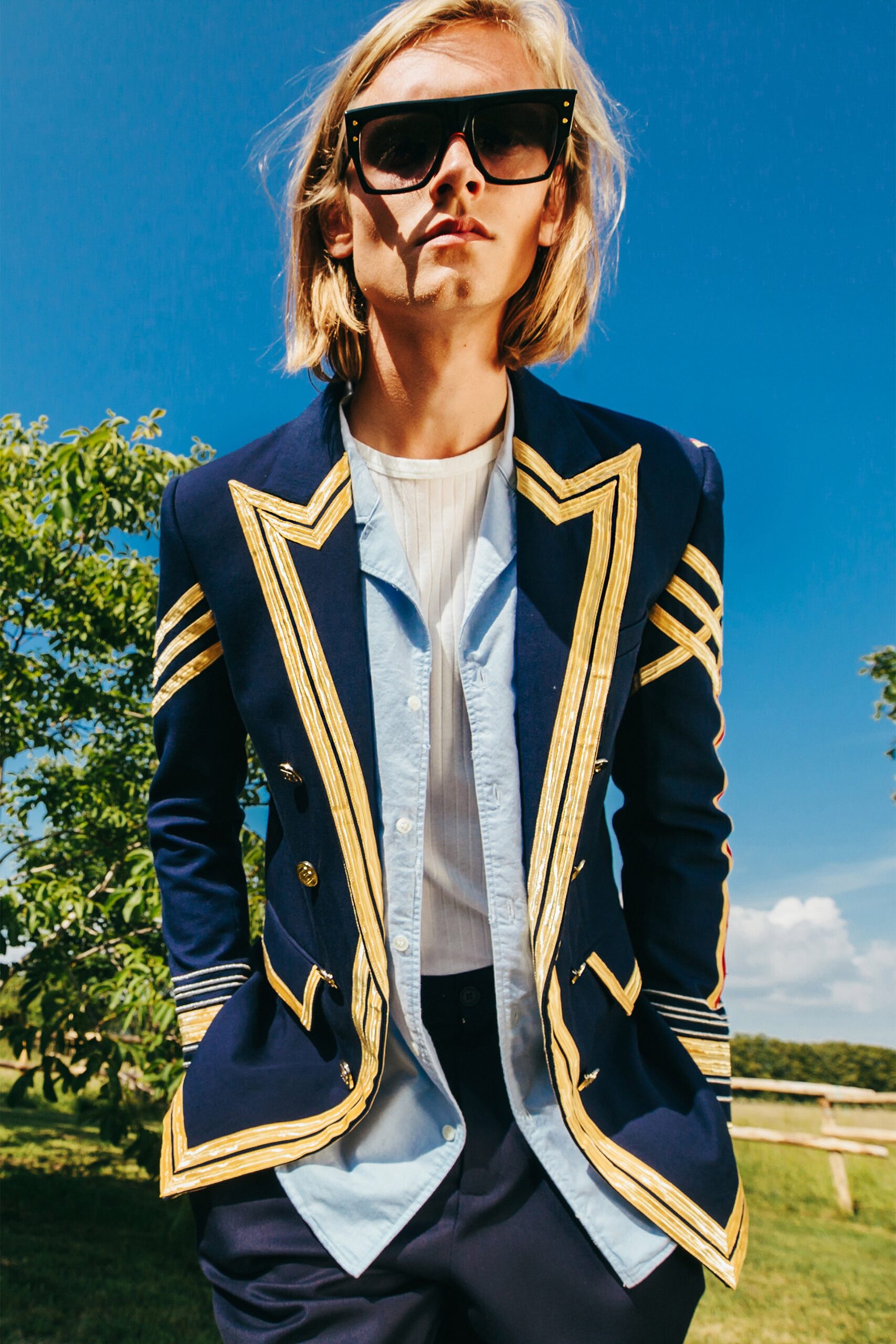 tailored blue blazer with gold details