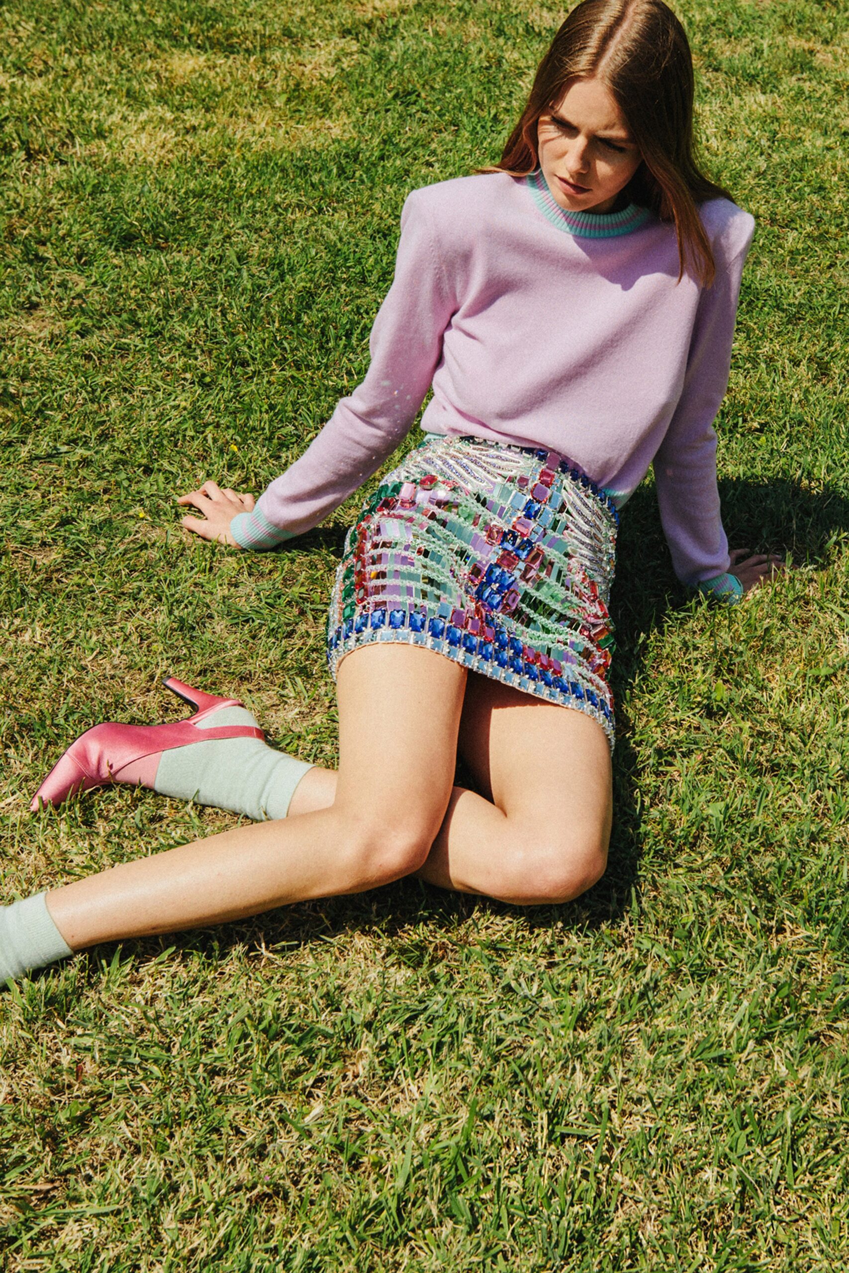 purple fitted sweater with mini skirt