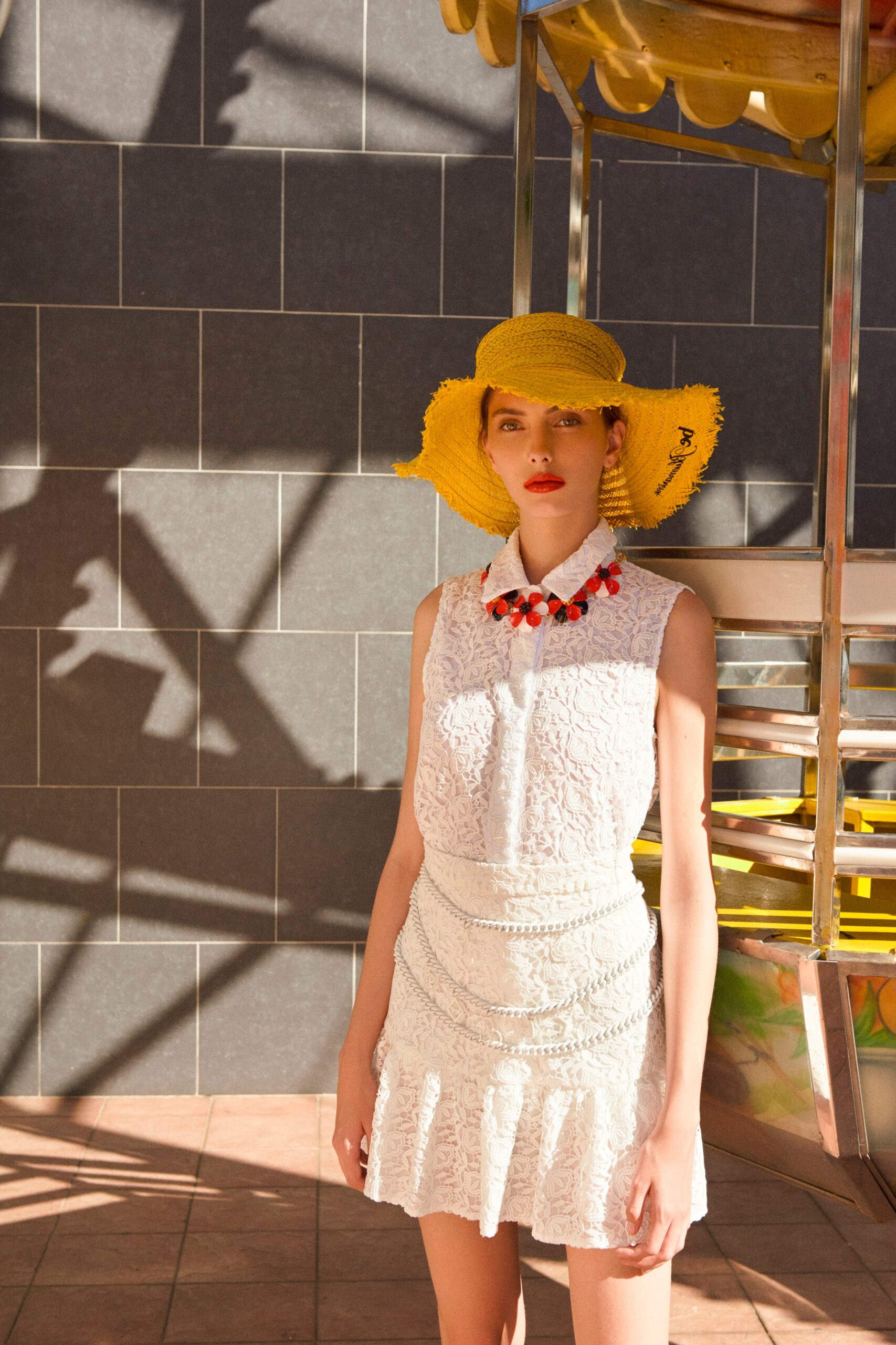 white lace mini dress with yellow hat
