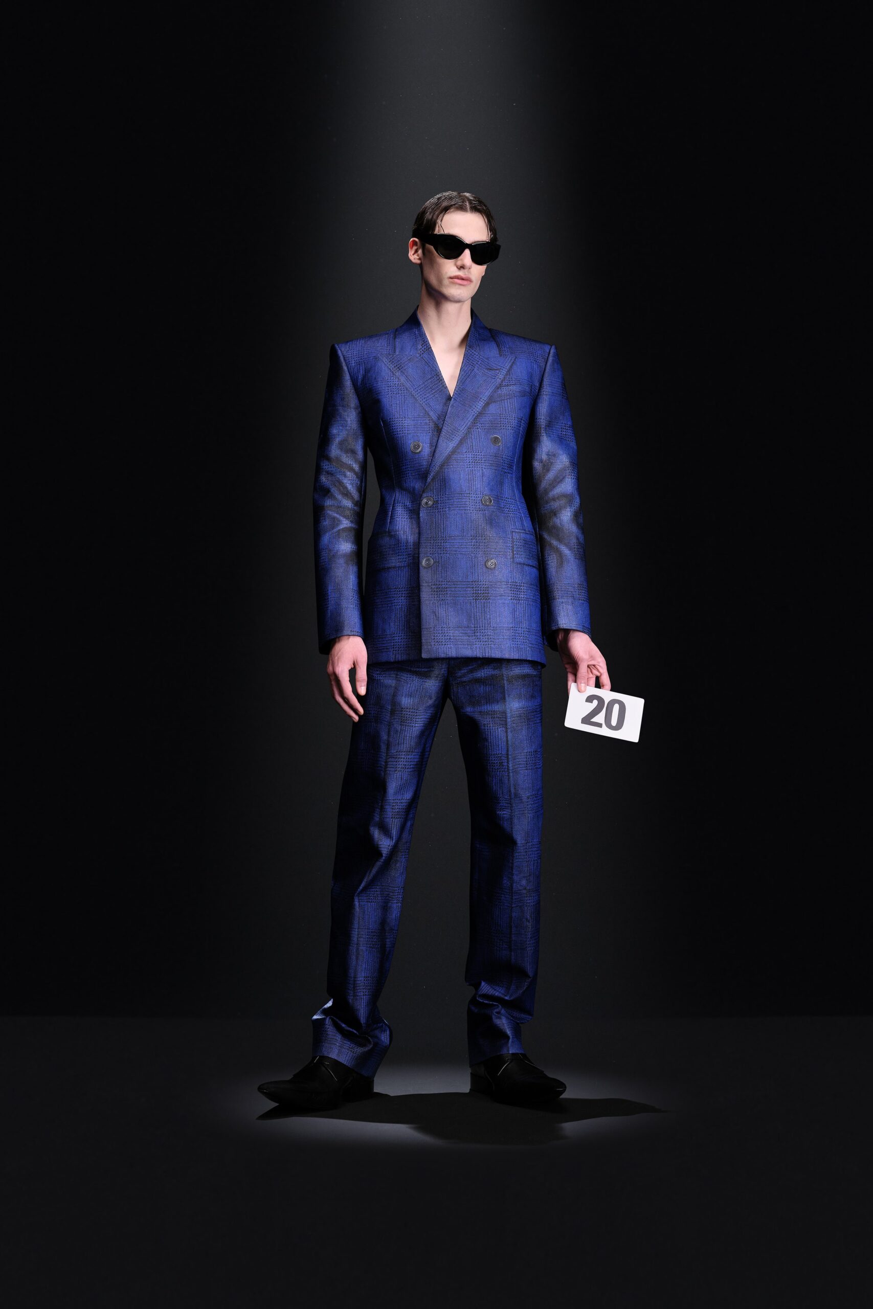 blue tailored suit with sunglasses