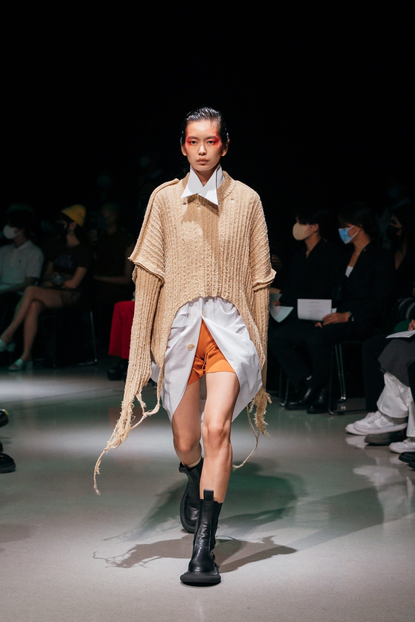 beige knit poncho with white shirt