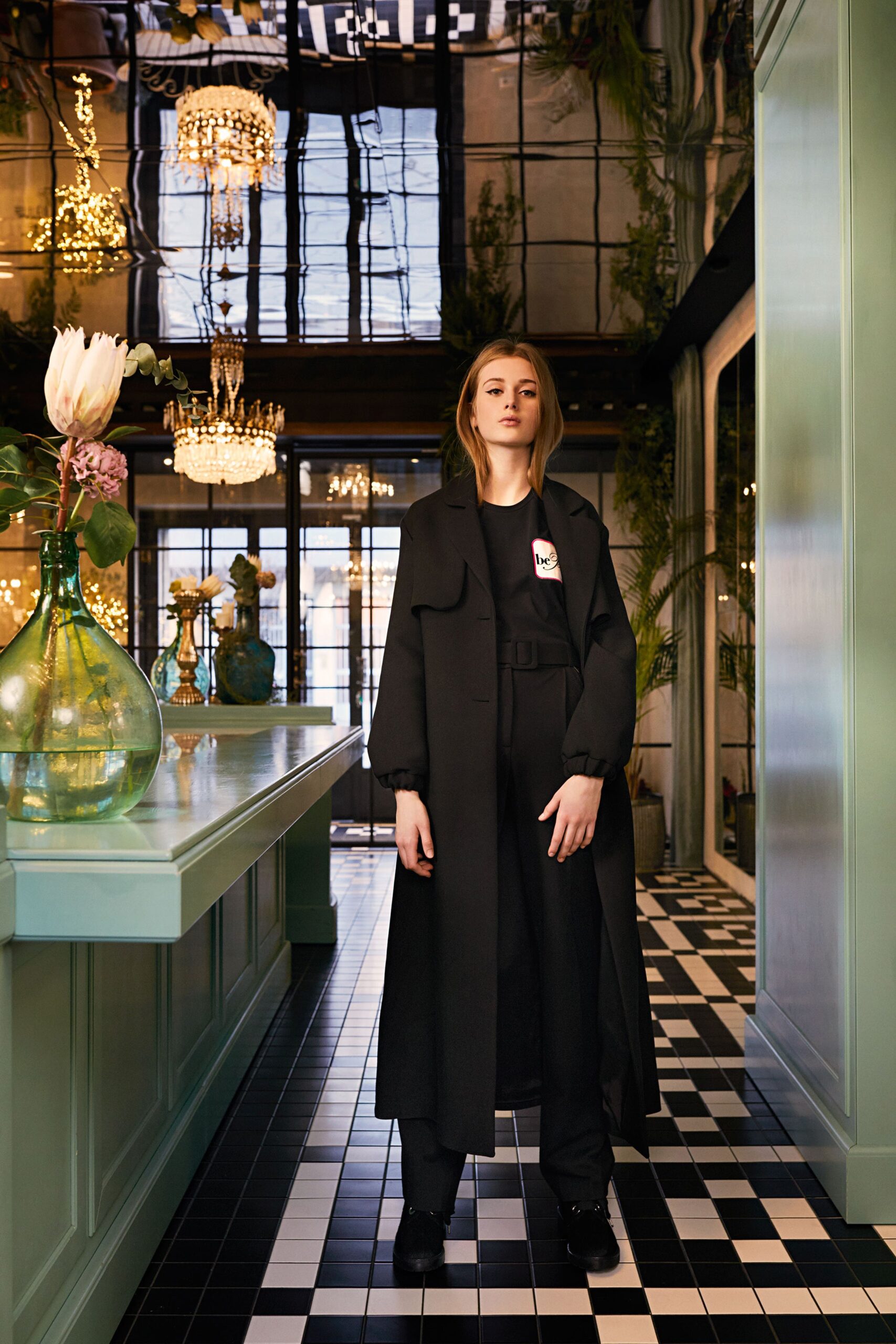 black relaxed coat and fitted pants