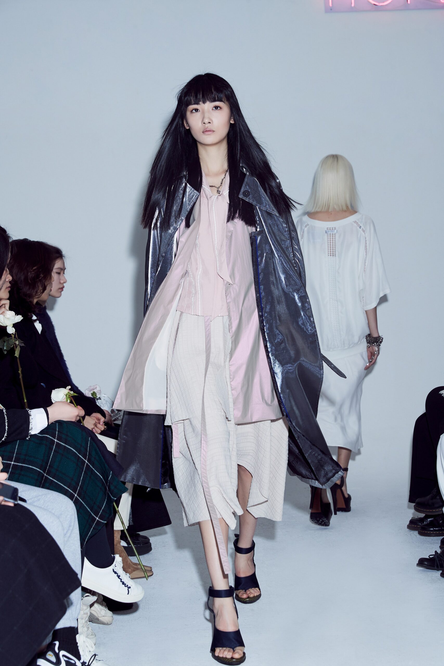 gray vinyl coat with pink blouse