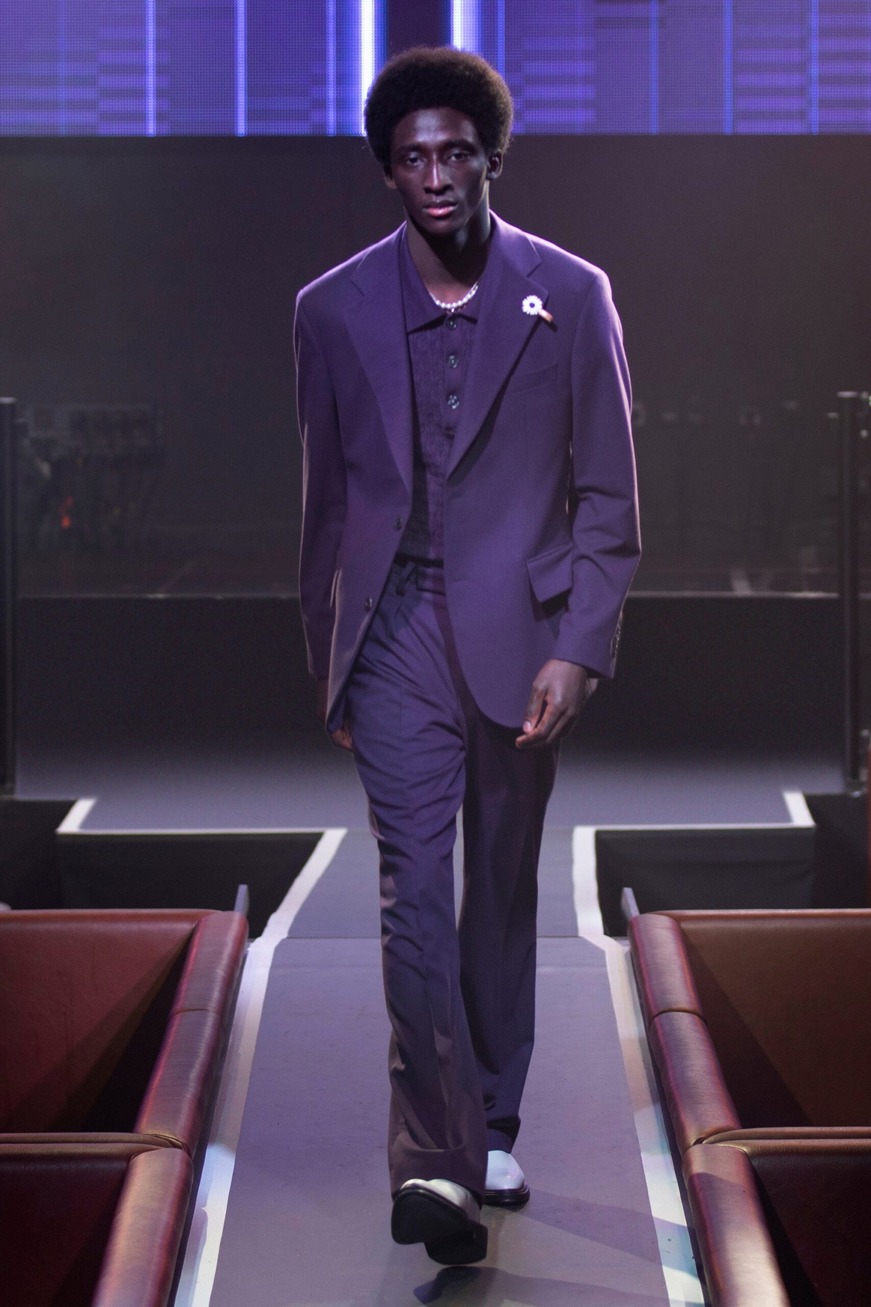purple tailored suit with black shirt