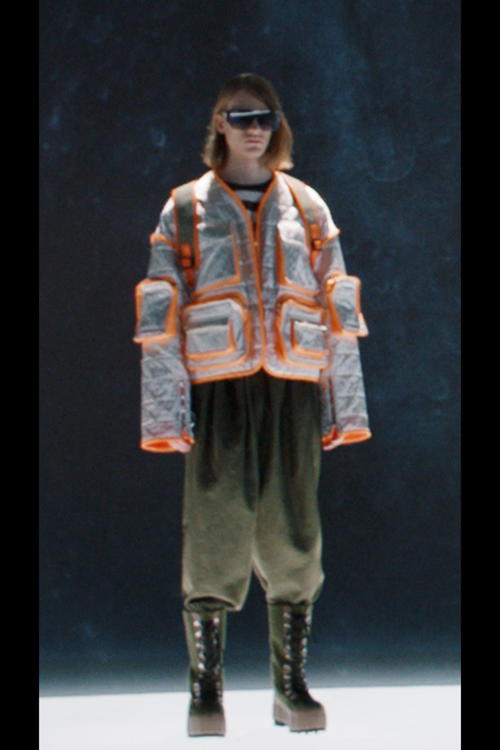 silver vinyl jacket with orange accents