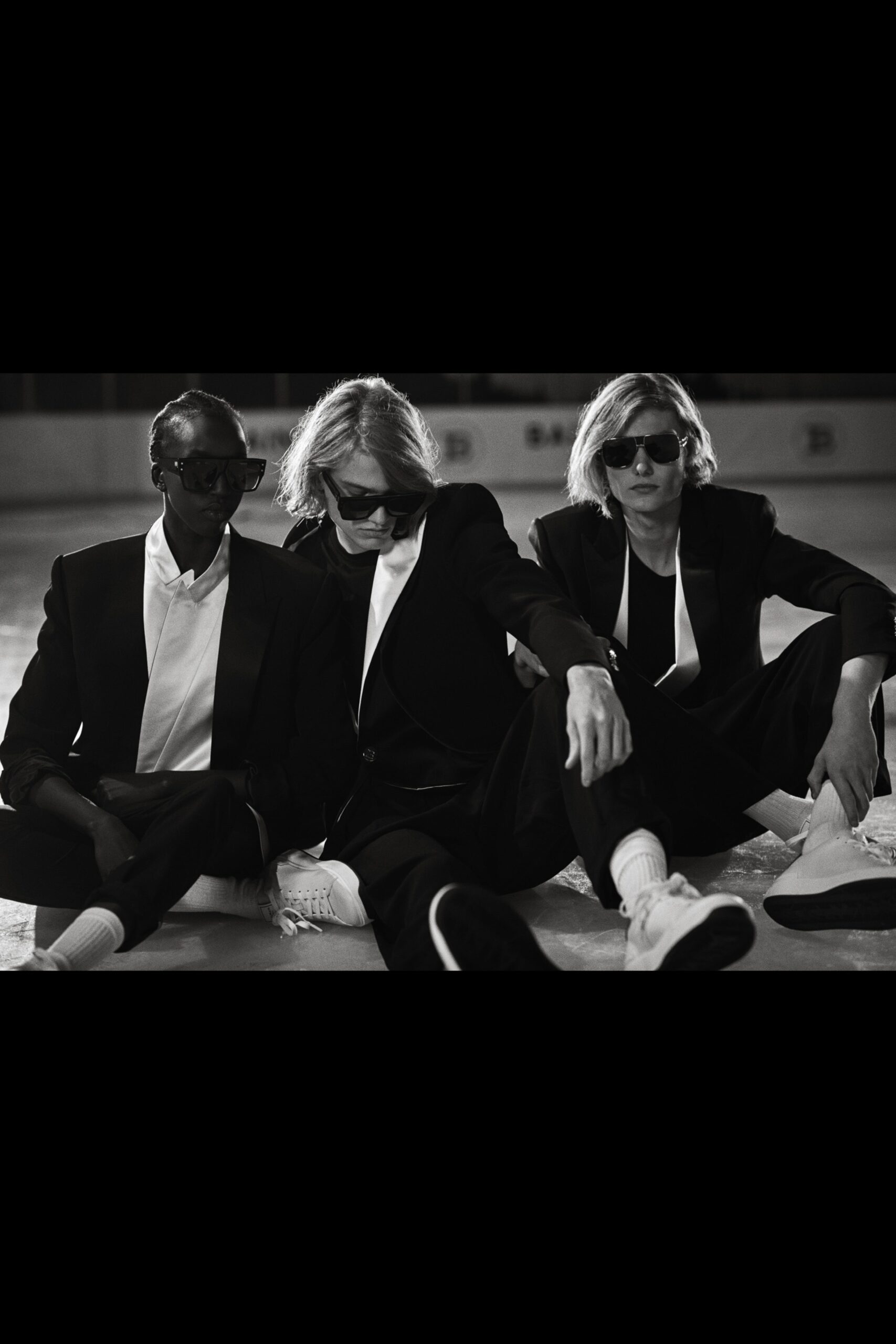 black tailored suit with sunglasses