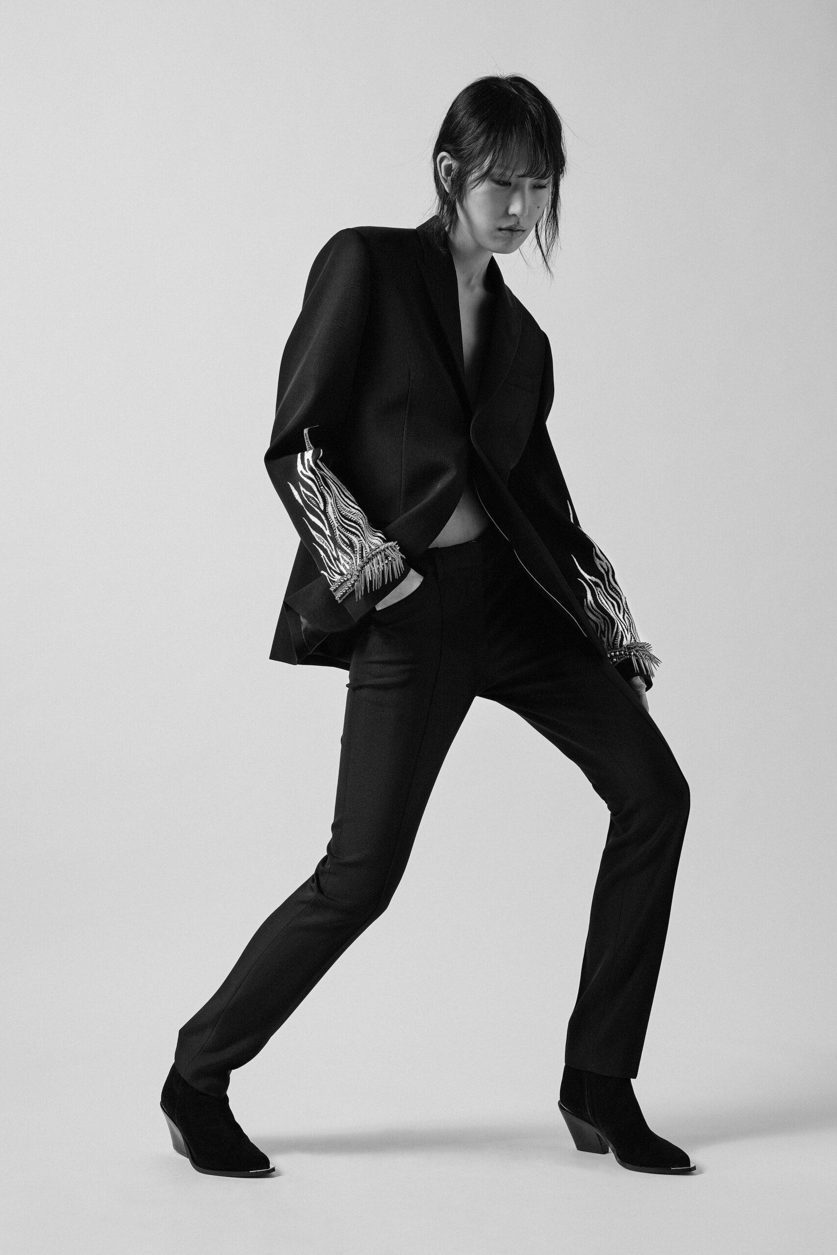black tailored blazer and slim pants