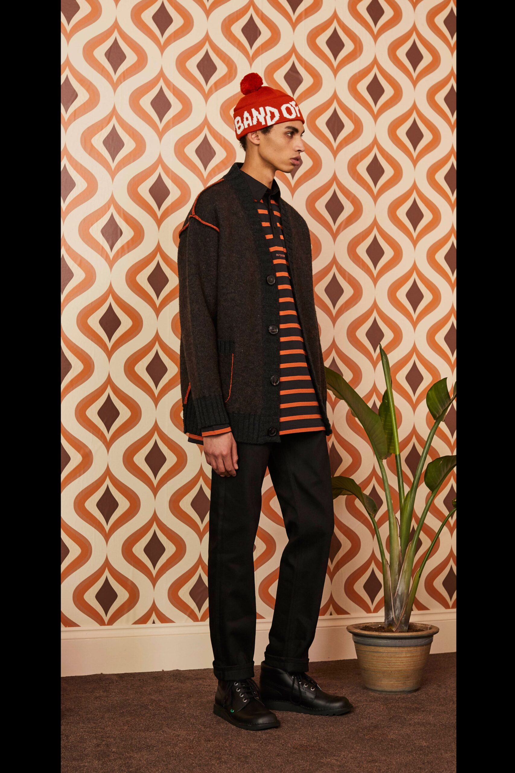 black cardigan orange striped shirt
