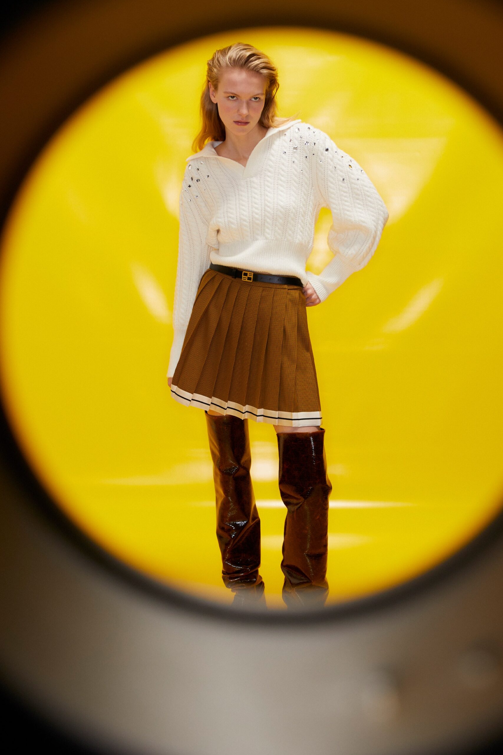 white fitted sweater with pleated skirt