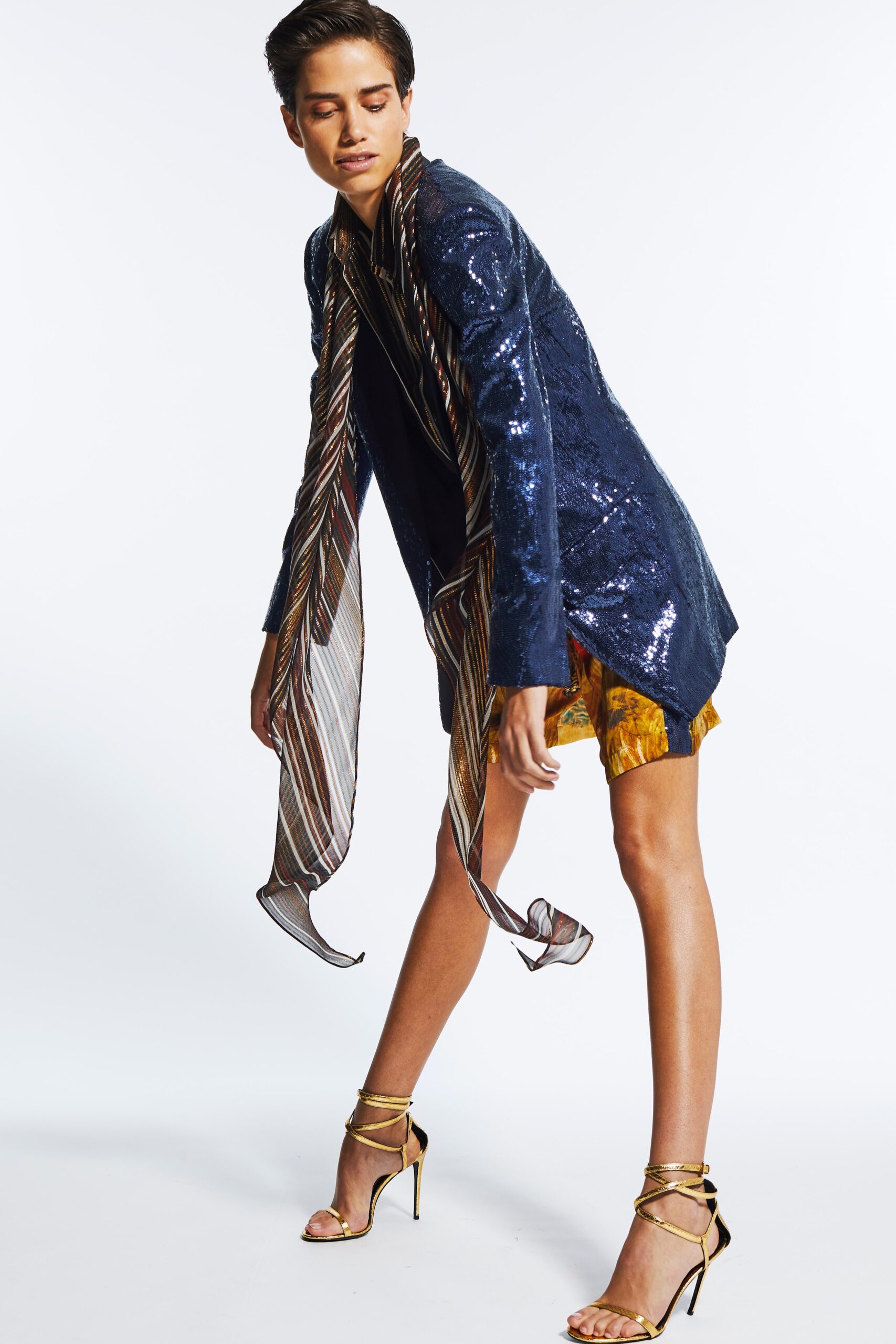 blue sequin blazer with yellow shorts