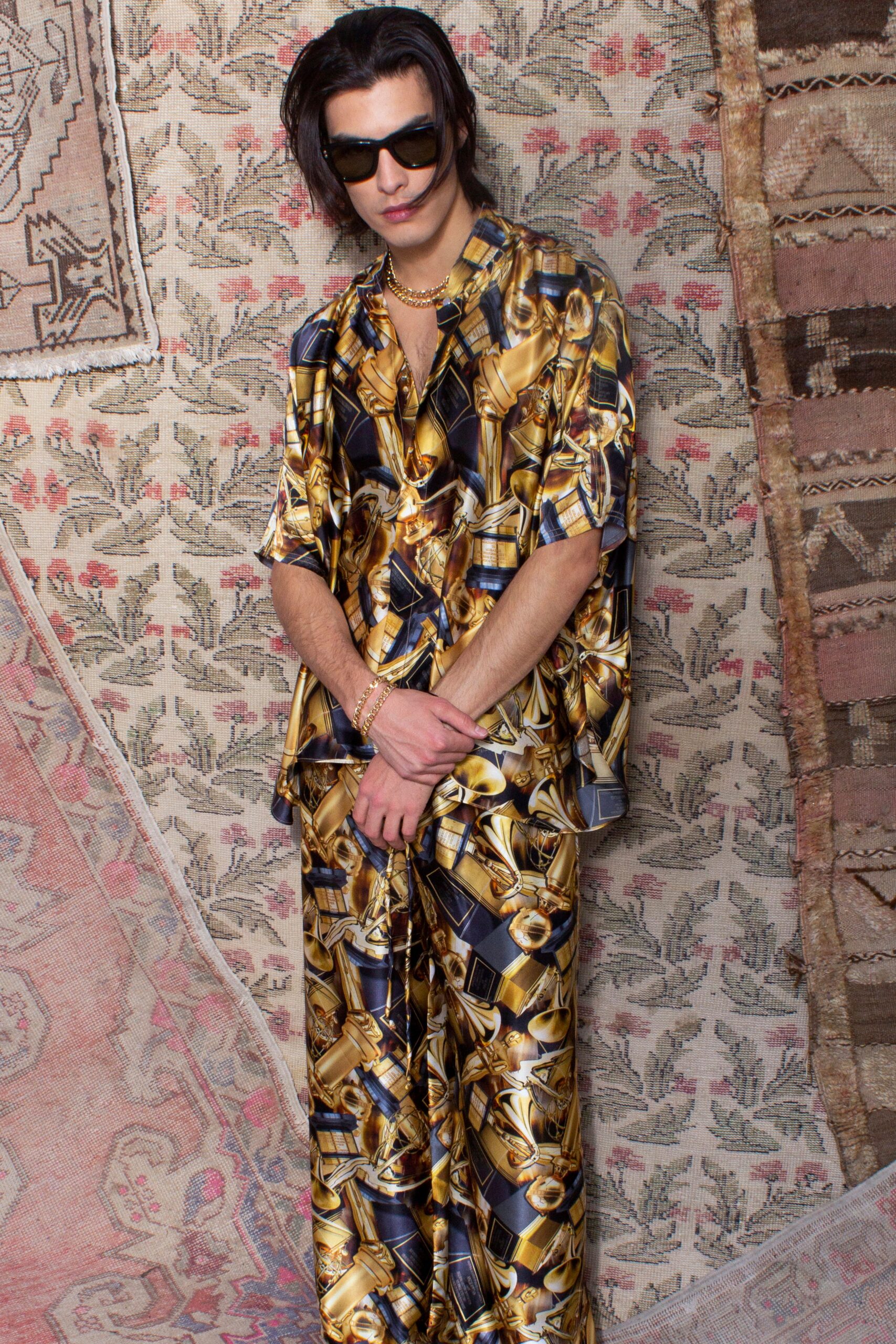 gold and black printed shirt and pants