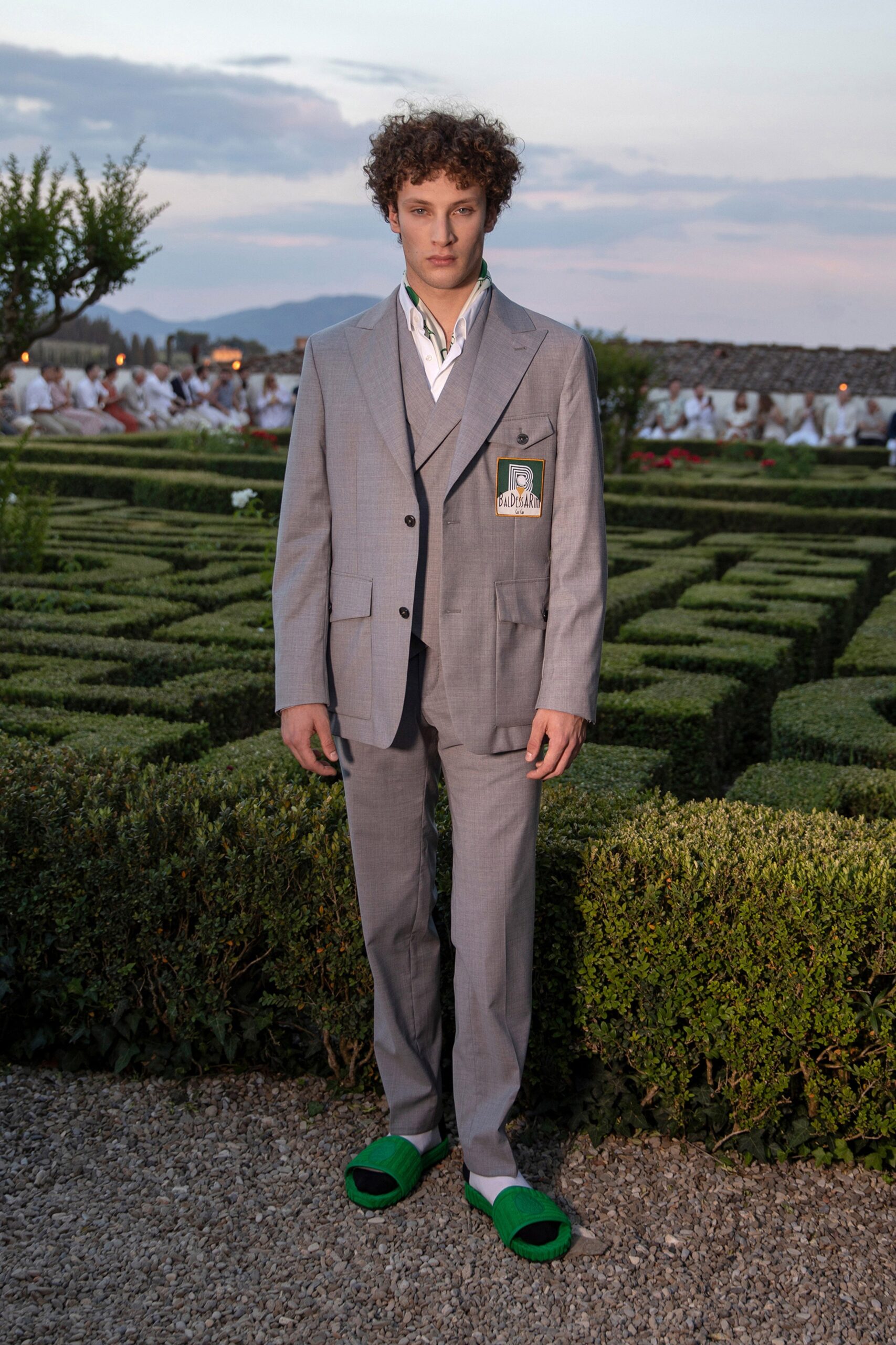 gray tailored suit with green shoes