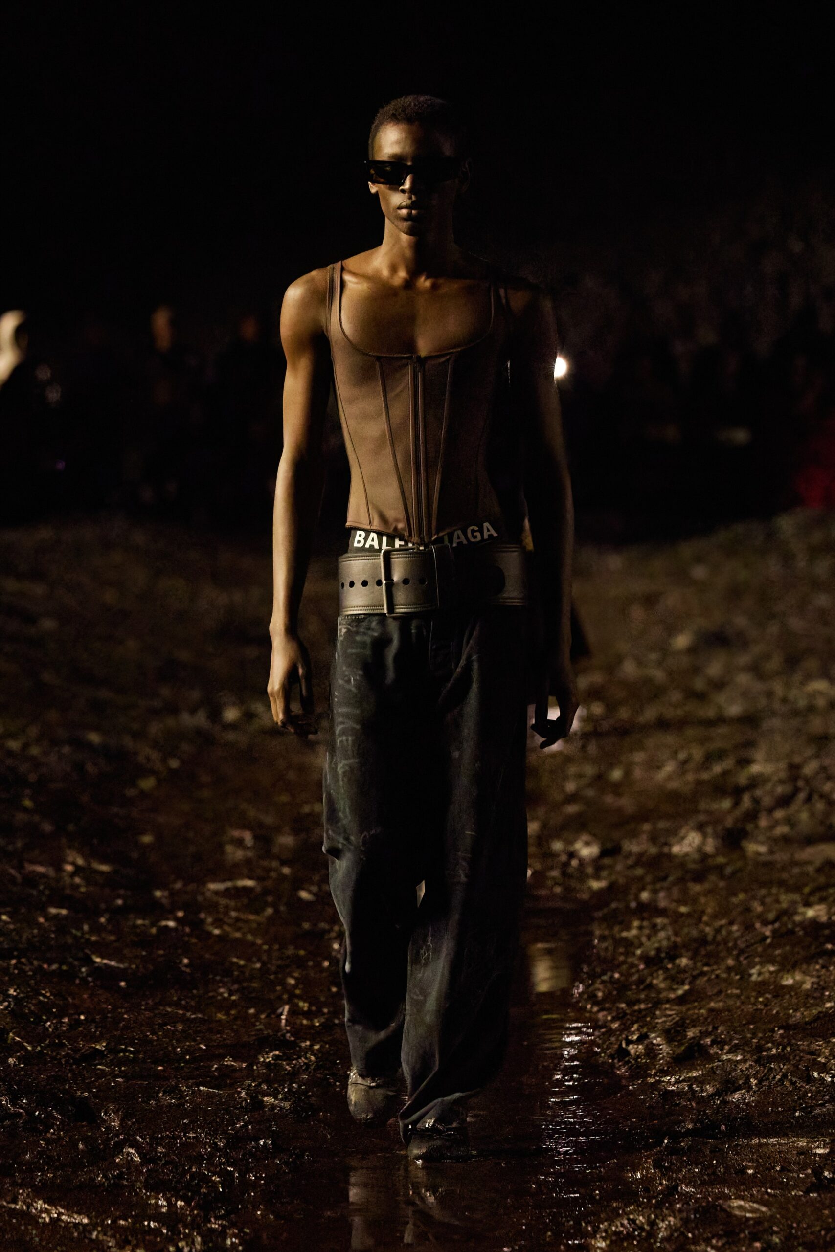 black mesh bodysuit and relaxed pants