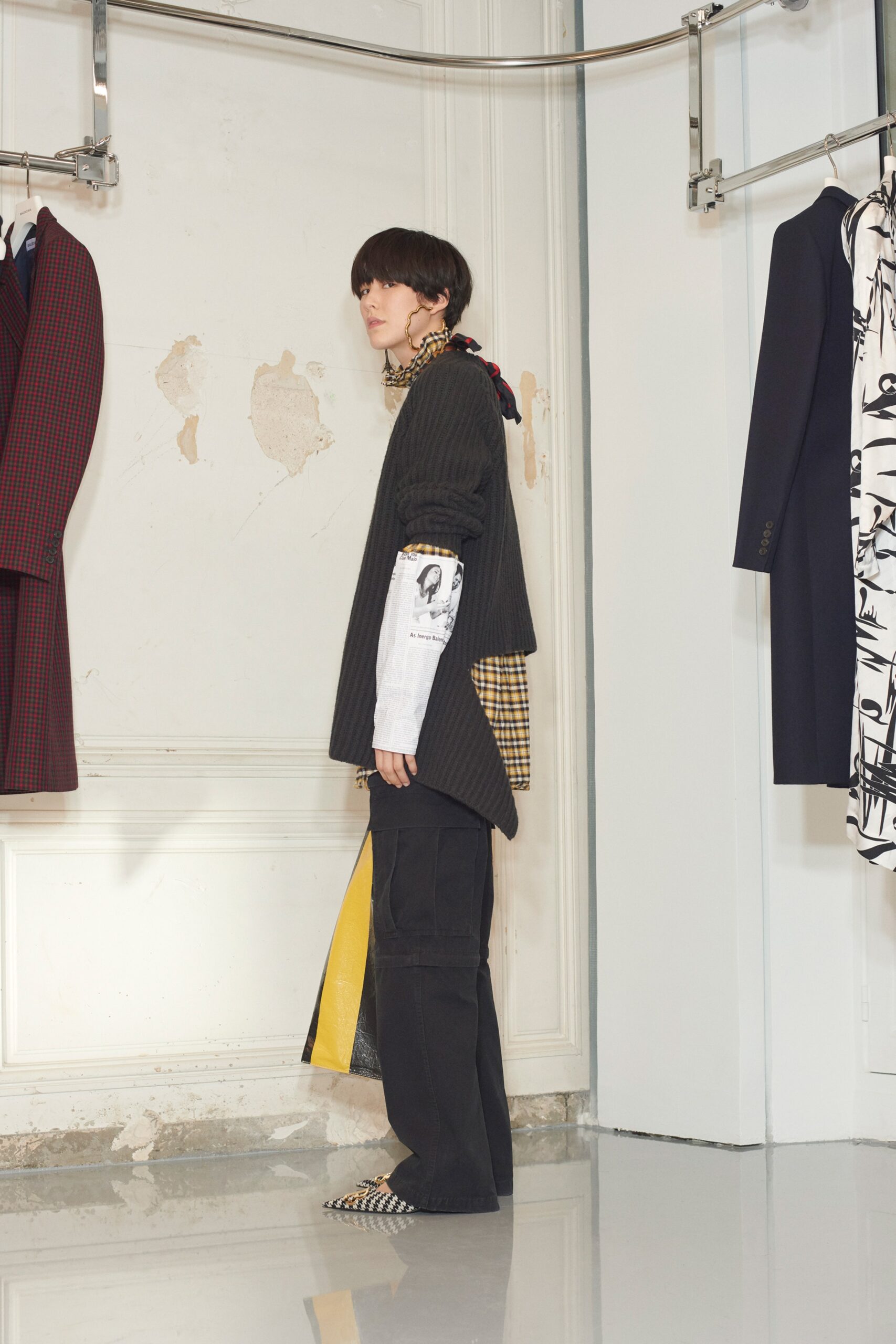 asymmetric black top with relaxed pants