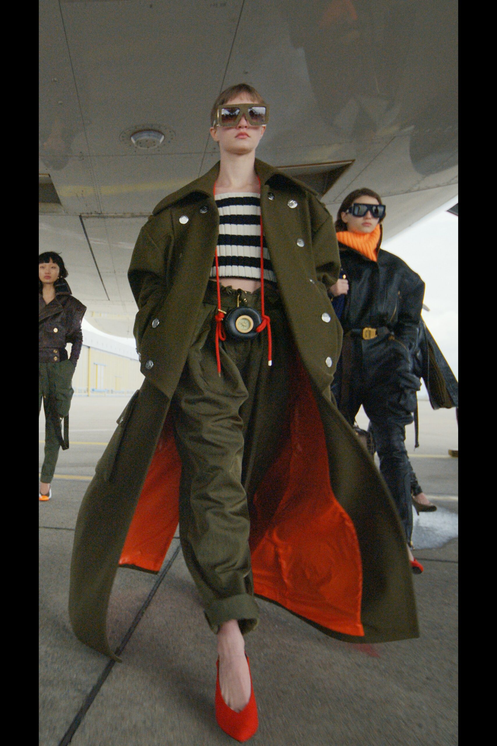 green relaxed coat with red shoes