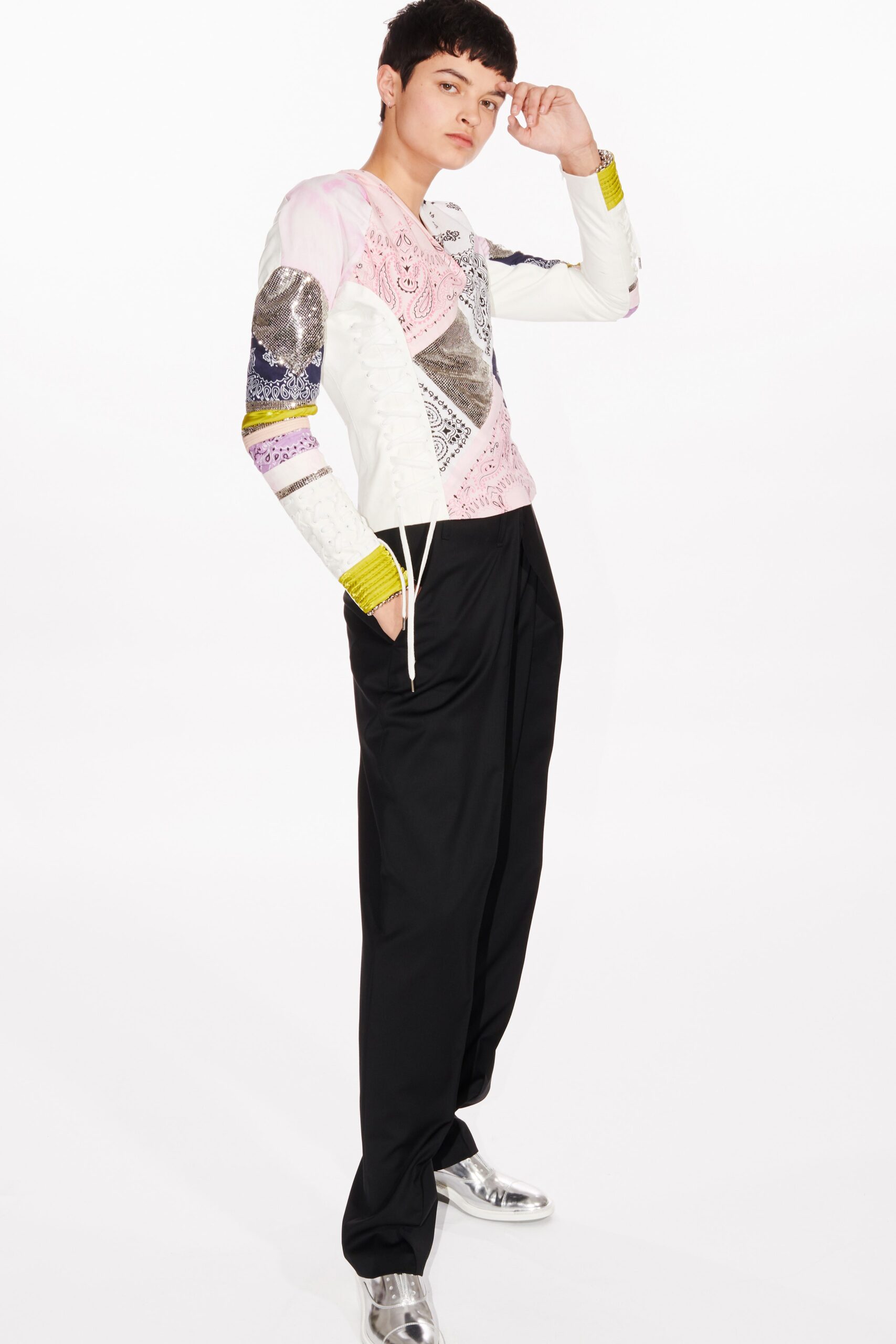 fitted pink embroidered top with relaxed black pants