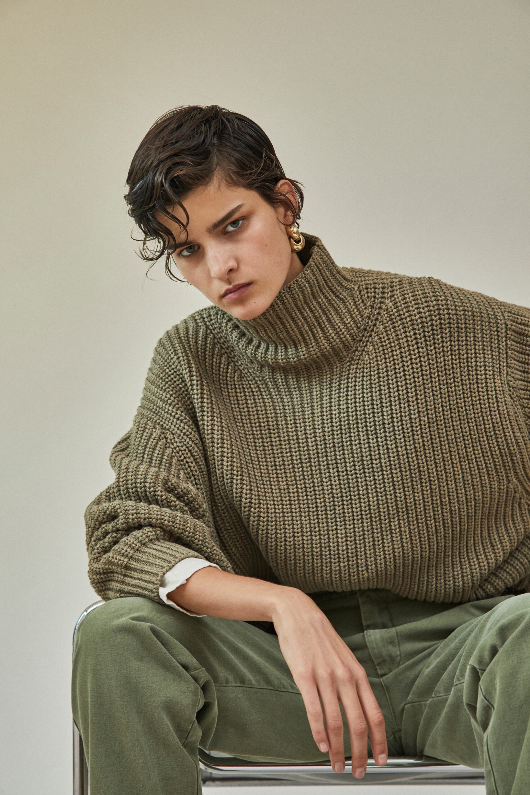 brown wool relaxed sweater and green pants