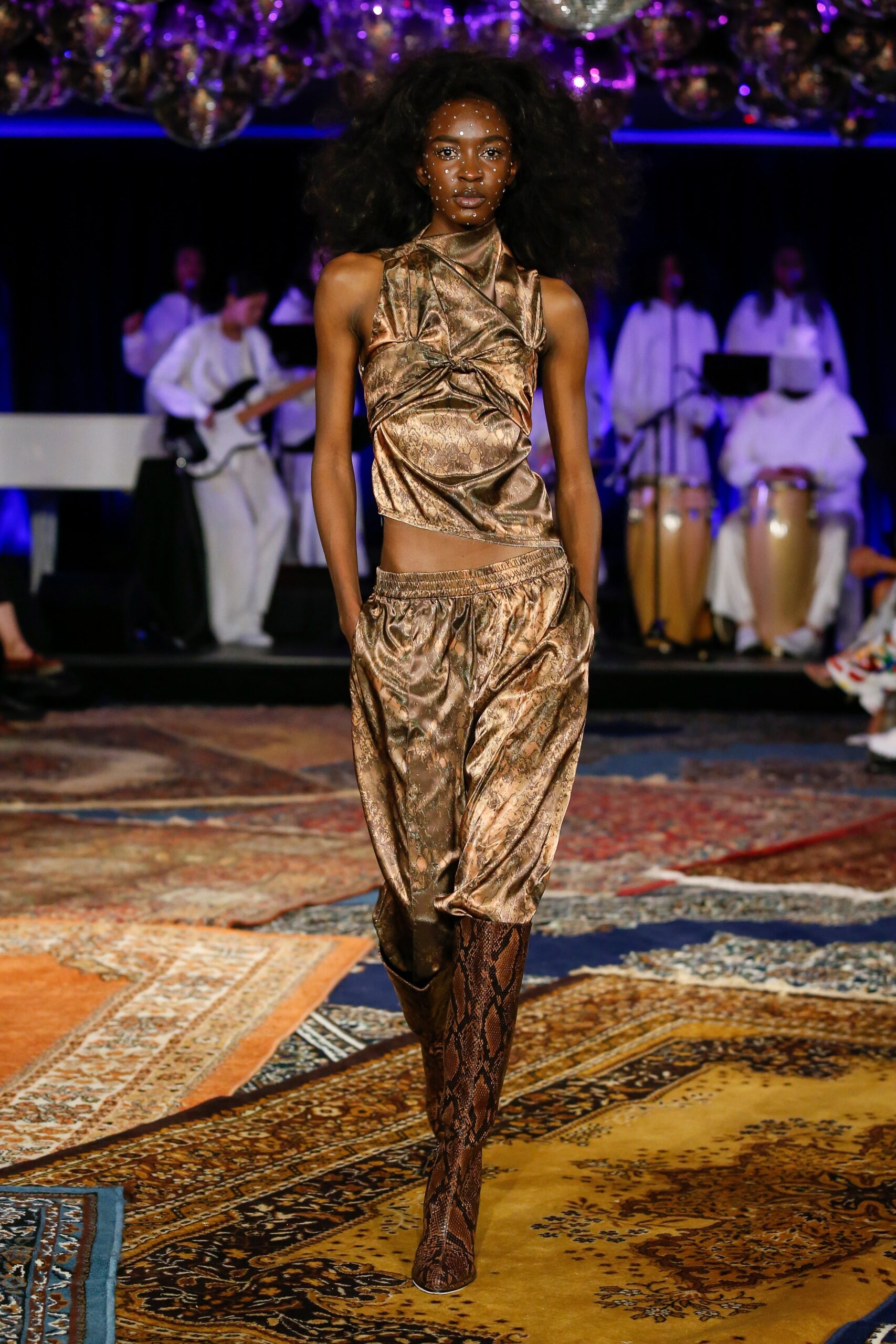 gold silk draped top with relaxed pants