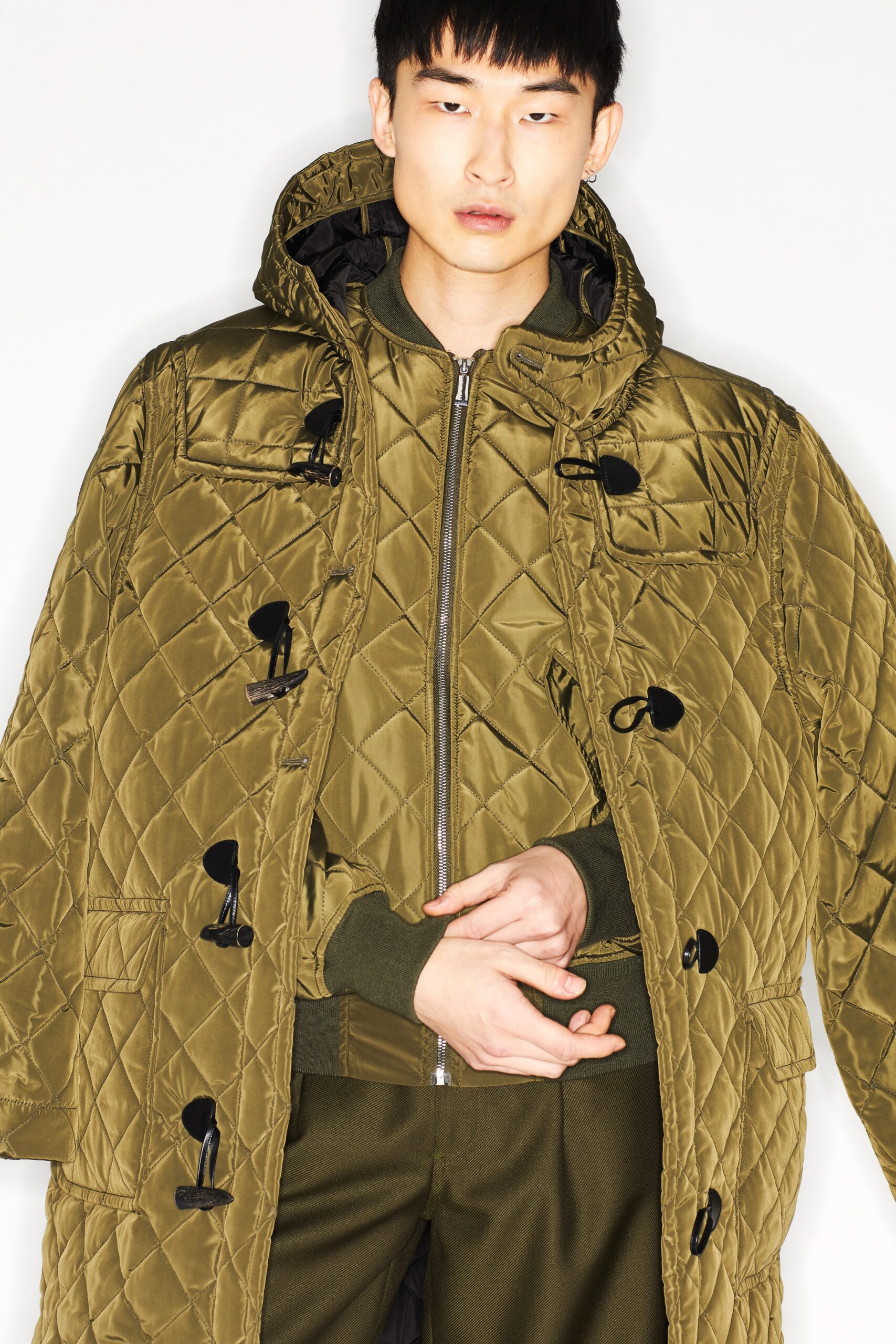 green quilted coat and jacket