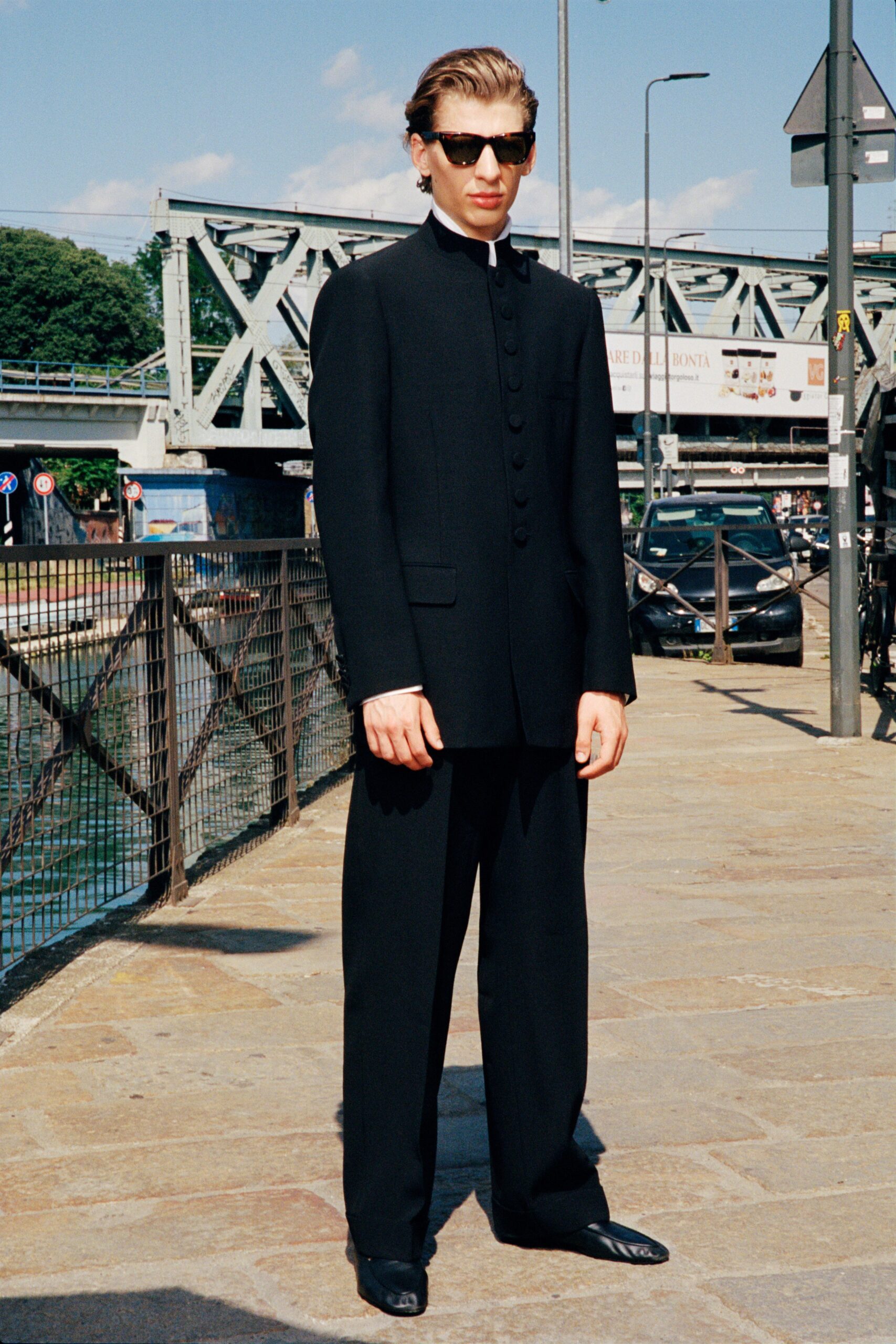 black tailored suit with sunglasses
