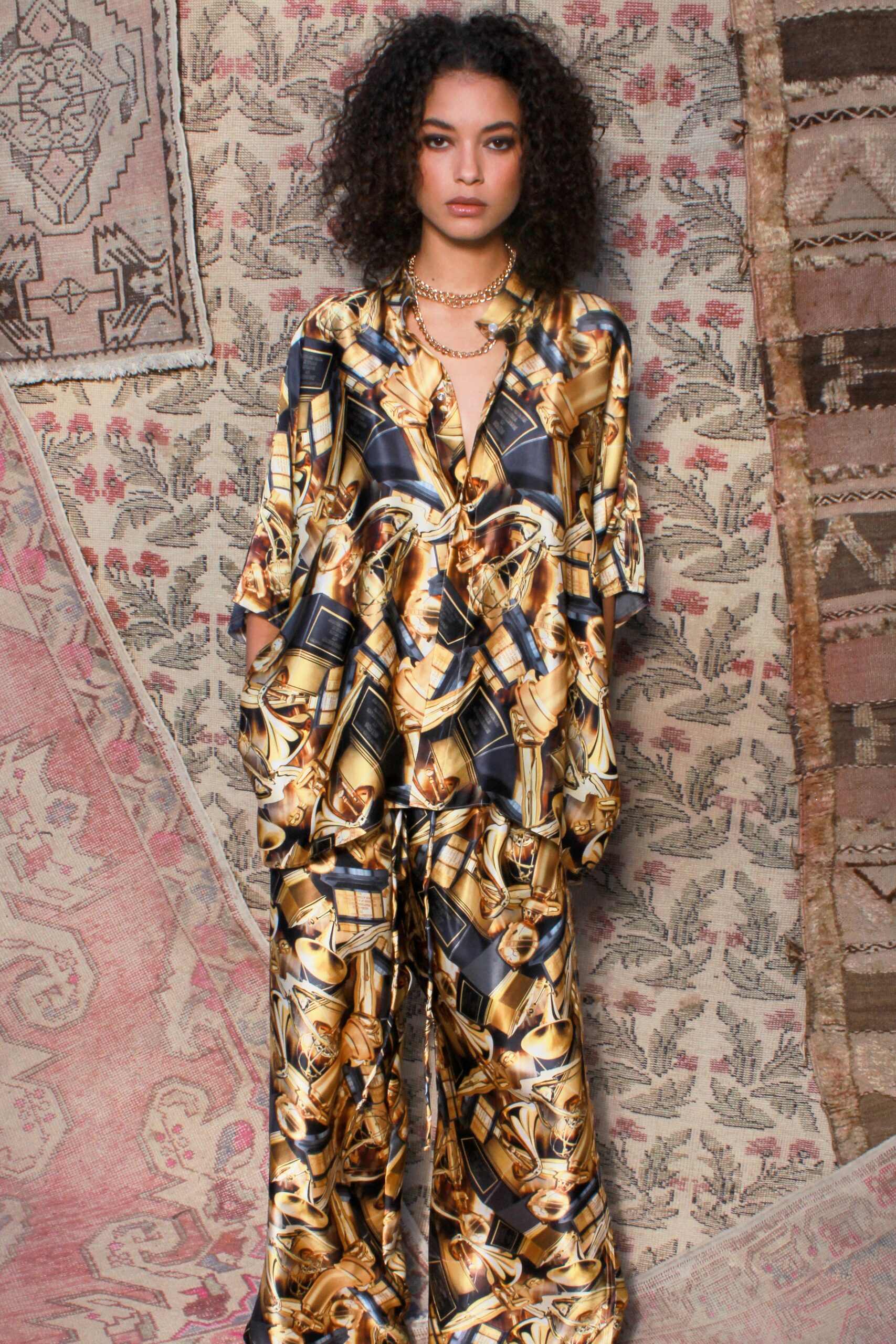 gold and black printed silk outfit