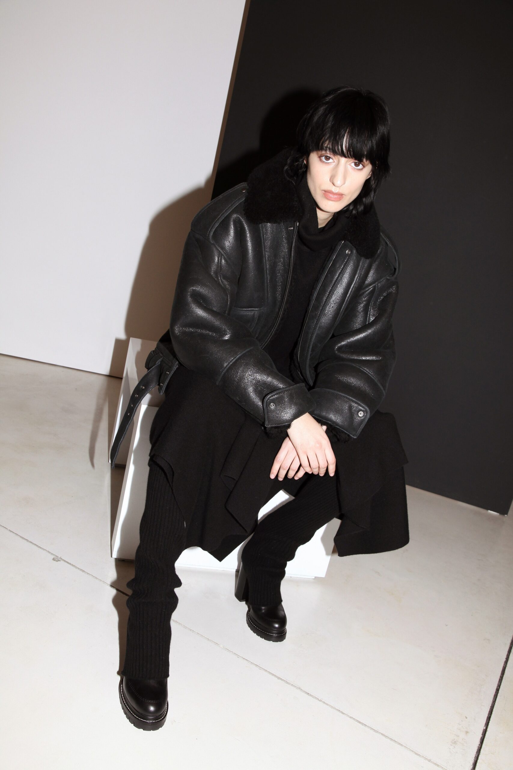 black oversized leather coat