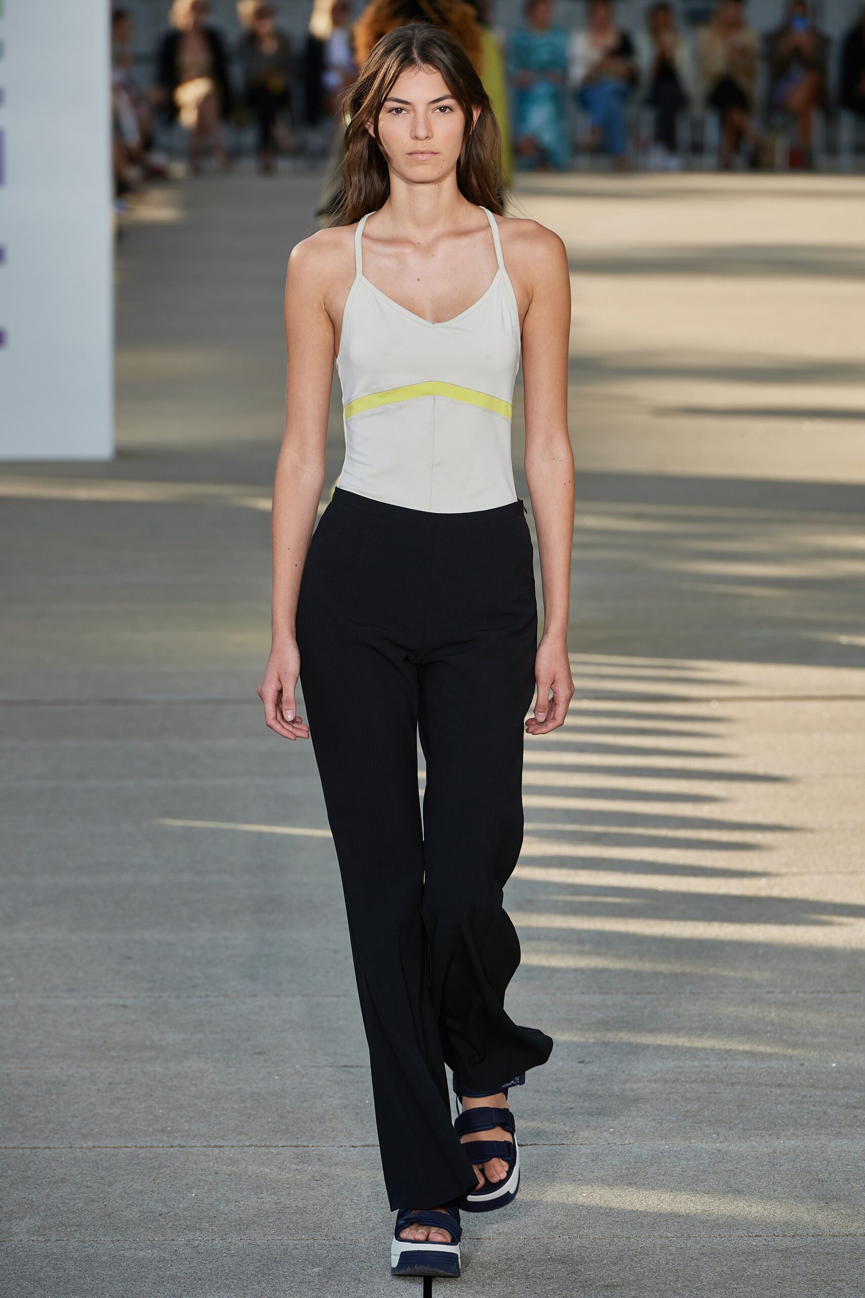 fitted white top and black flared pants