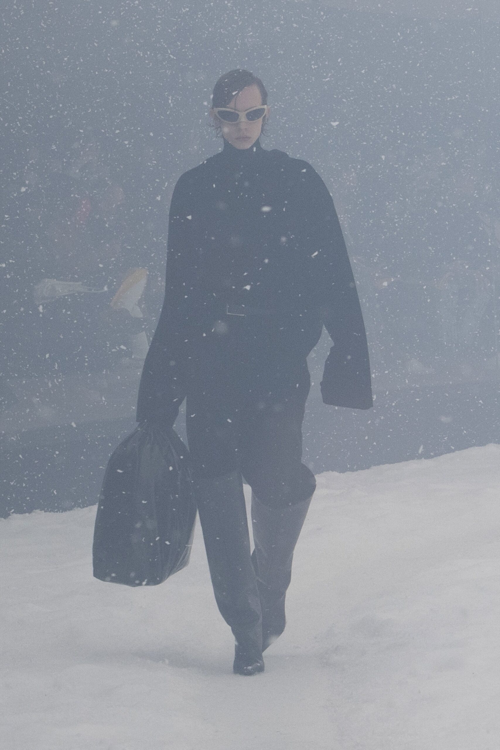 black oversized cape with leather pants