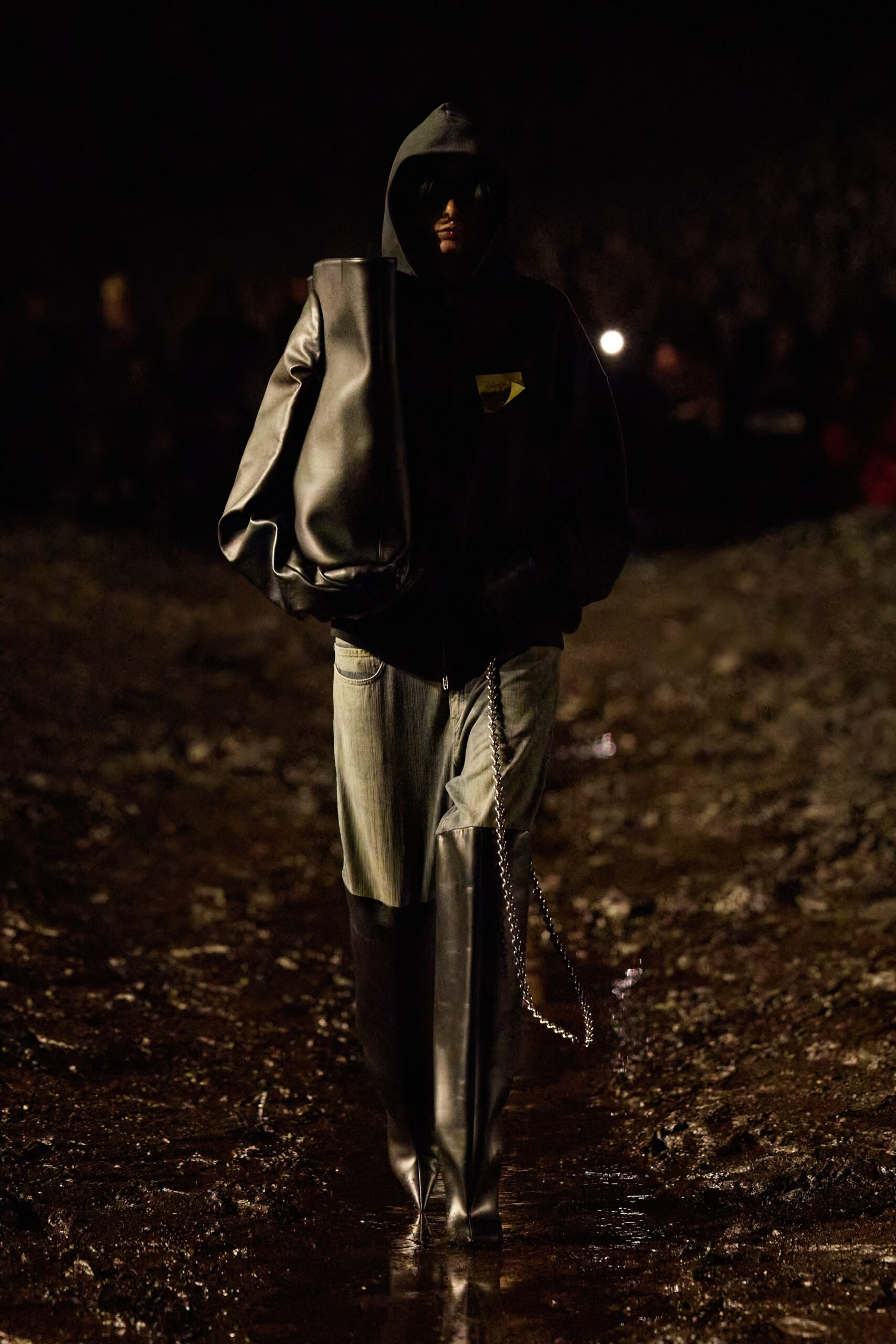 black leather oversized jacket and gray denim pants