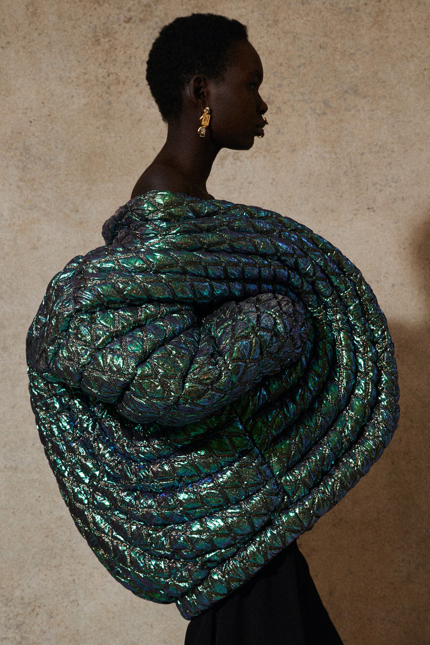 shiny black quilted cape