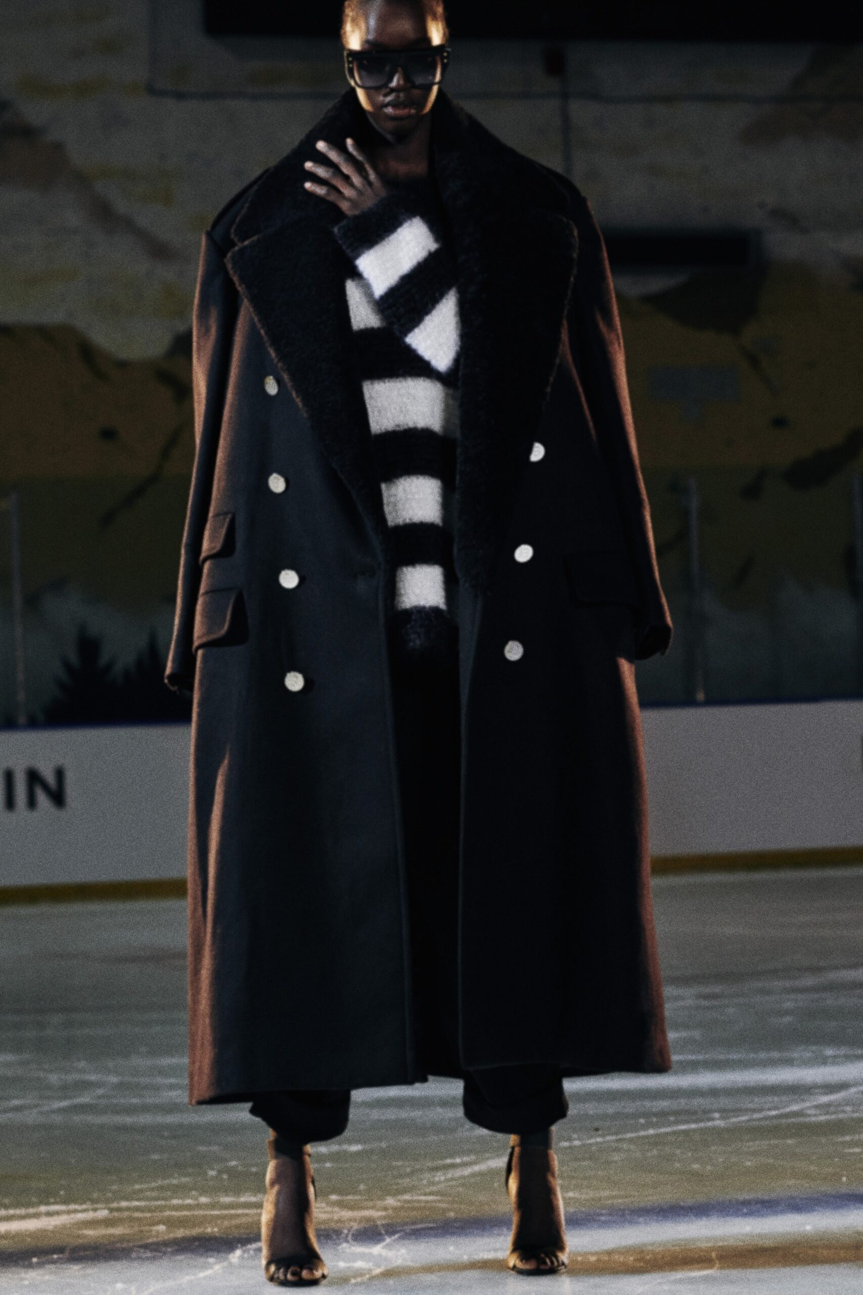 black wool coat with striped sweater