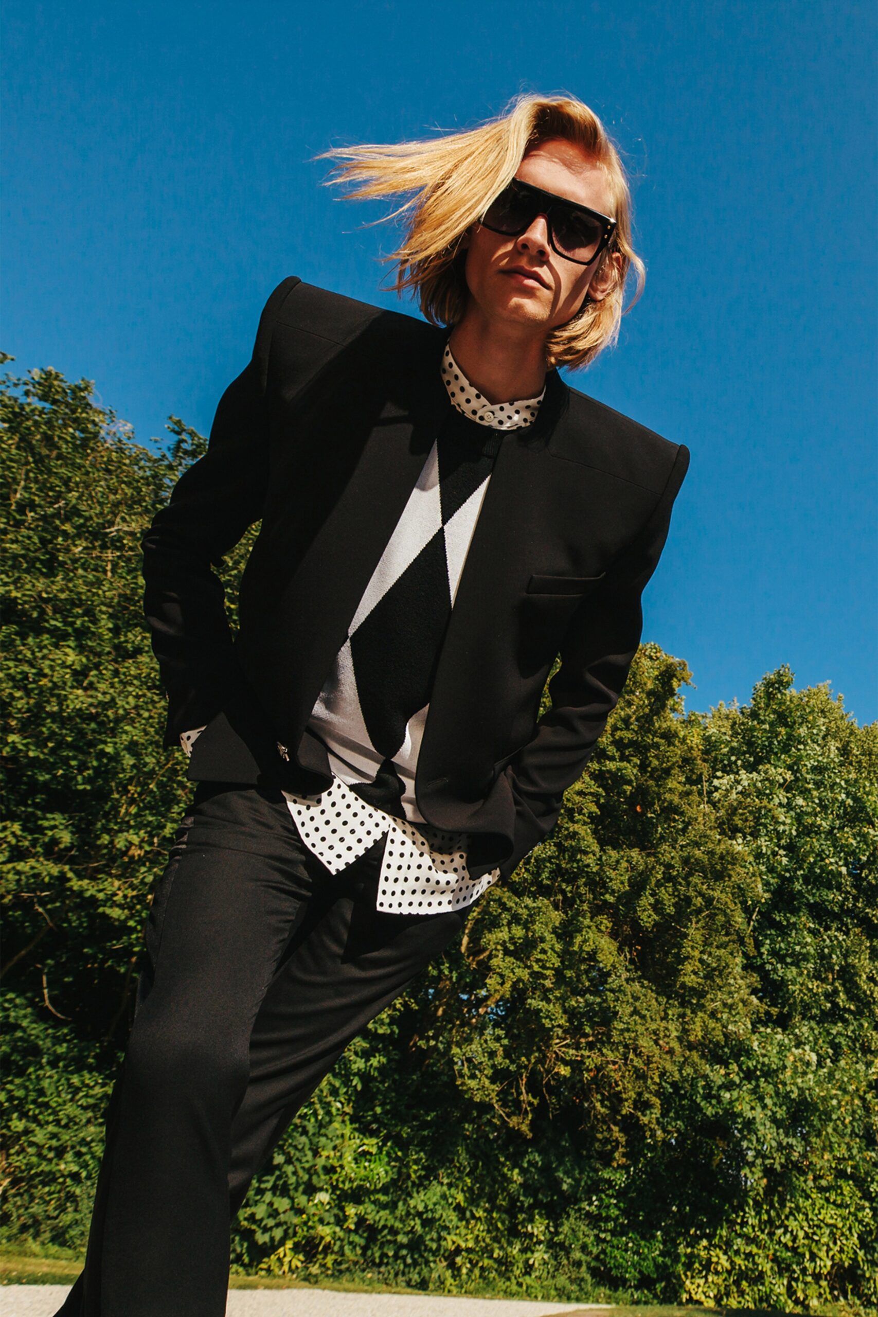 black tailored blazer with polka-dot shirt