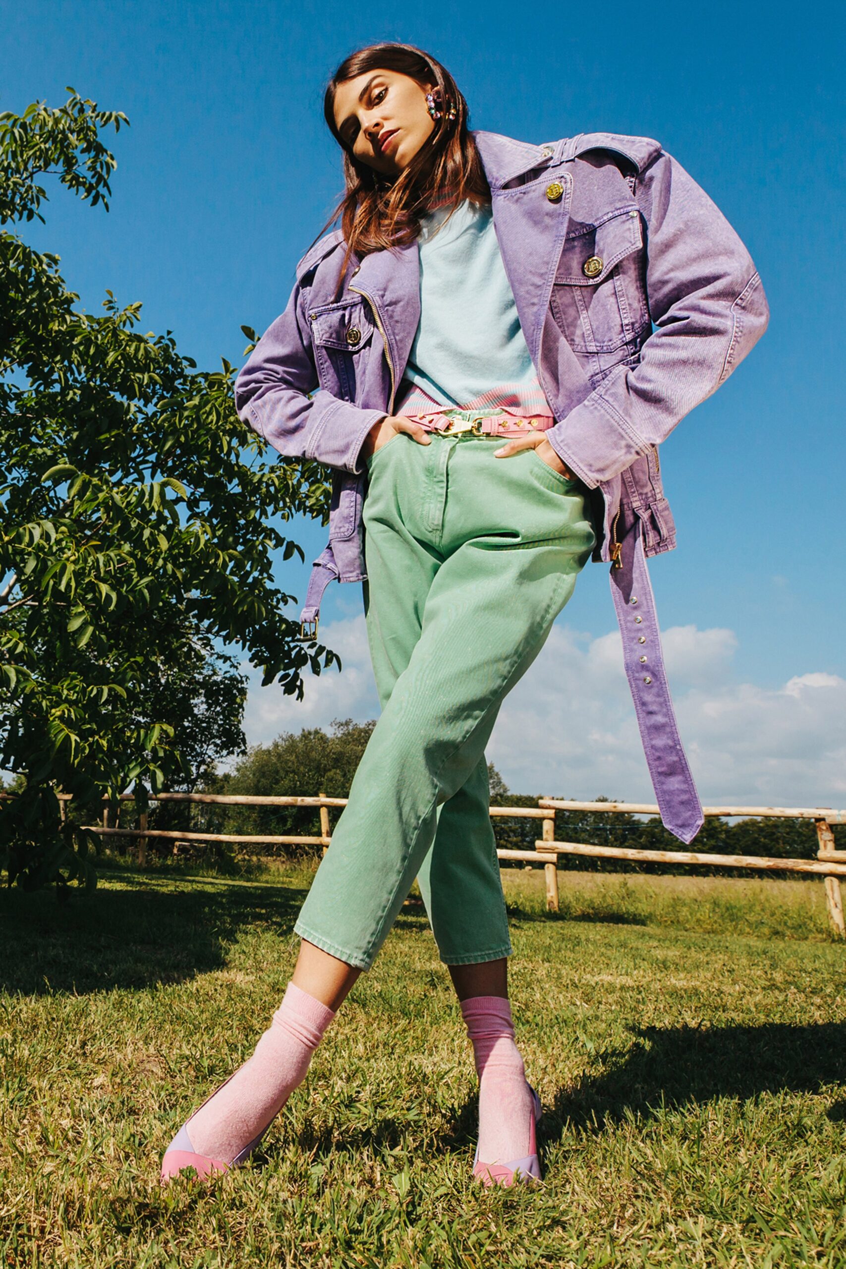purple jacket with blue top and green pants