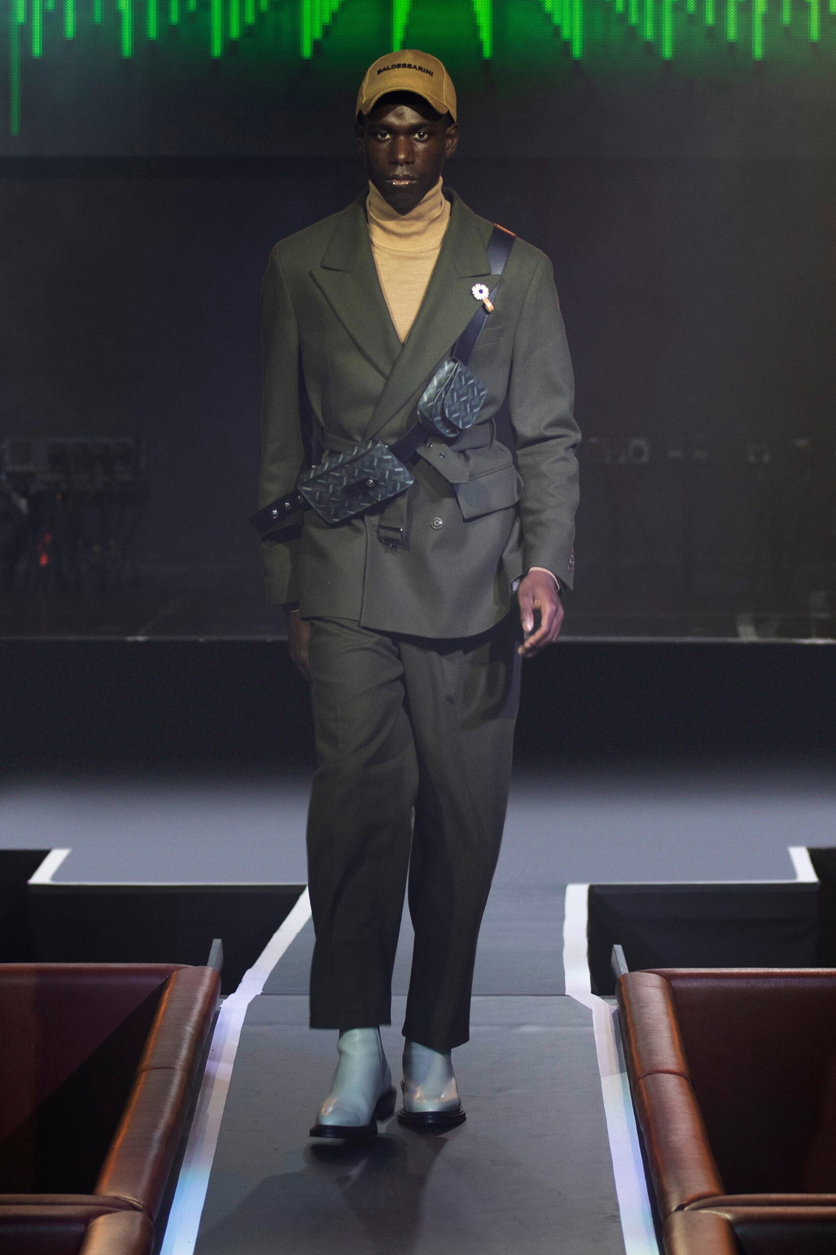 green tailored suit with turtleneck