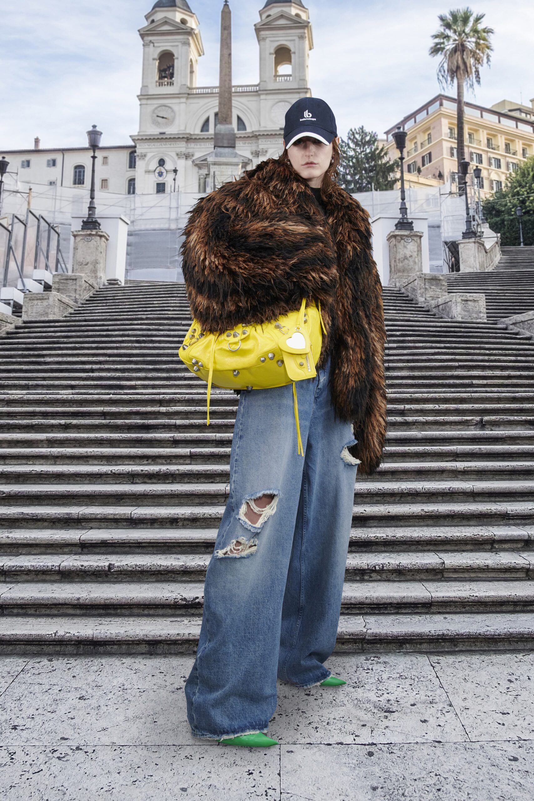 oversized brown fur coat with distressed jeans