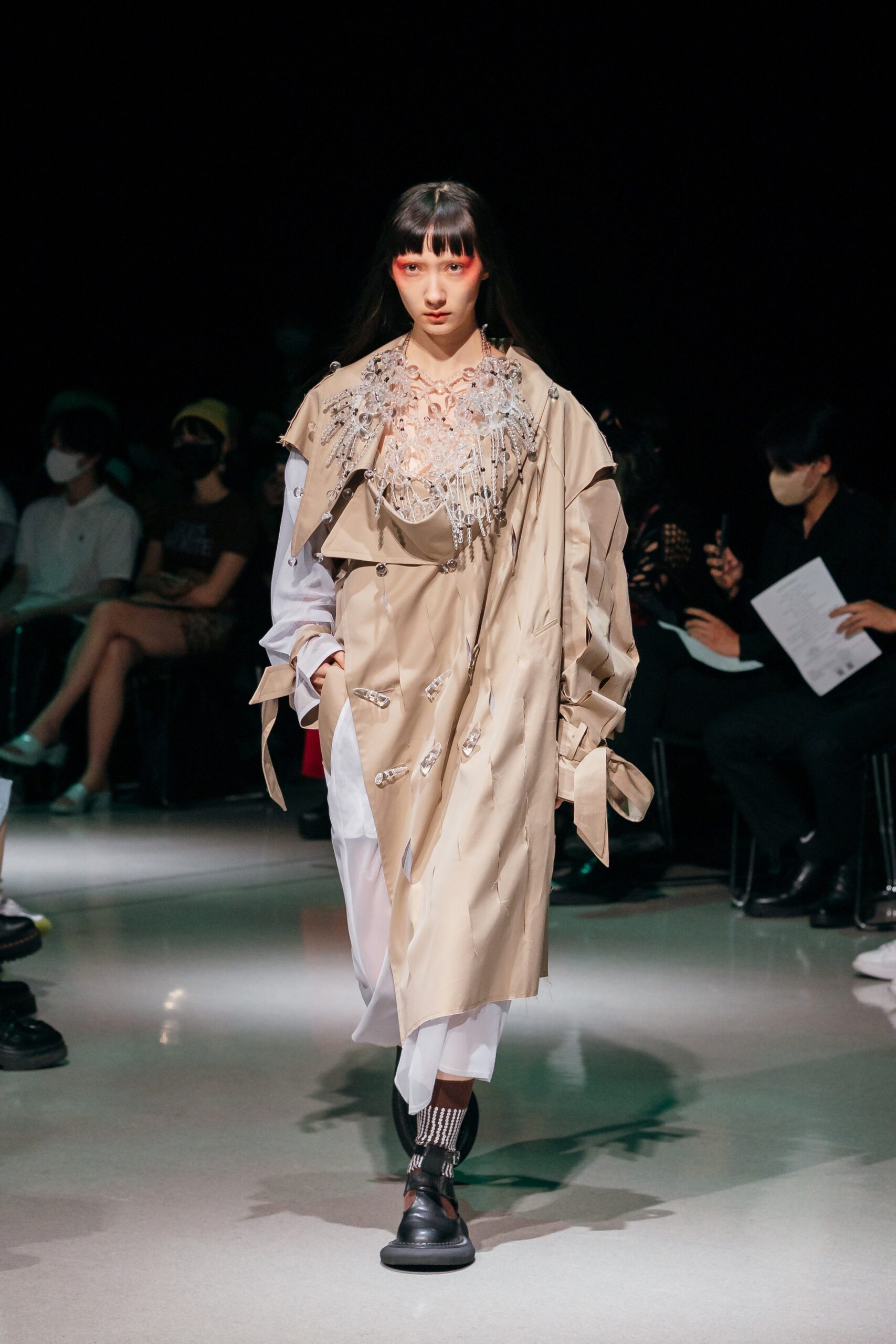 beige coat with embroidered details